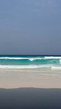 Discover the pristine beauty of Socotra with turquoise waves and untouched sandy shores.