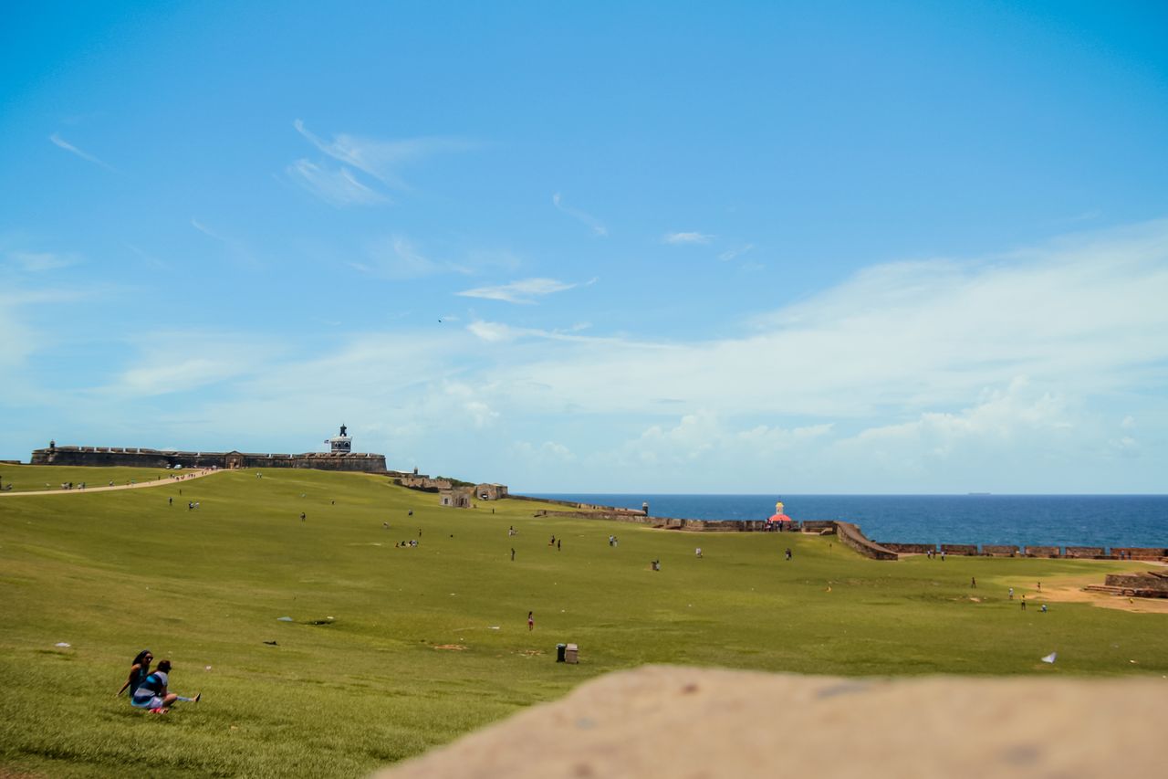 sunny day at el morro in san juan showcasing vast green space and ocea