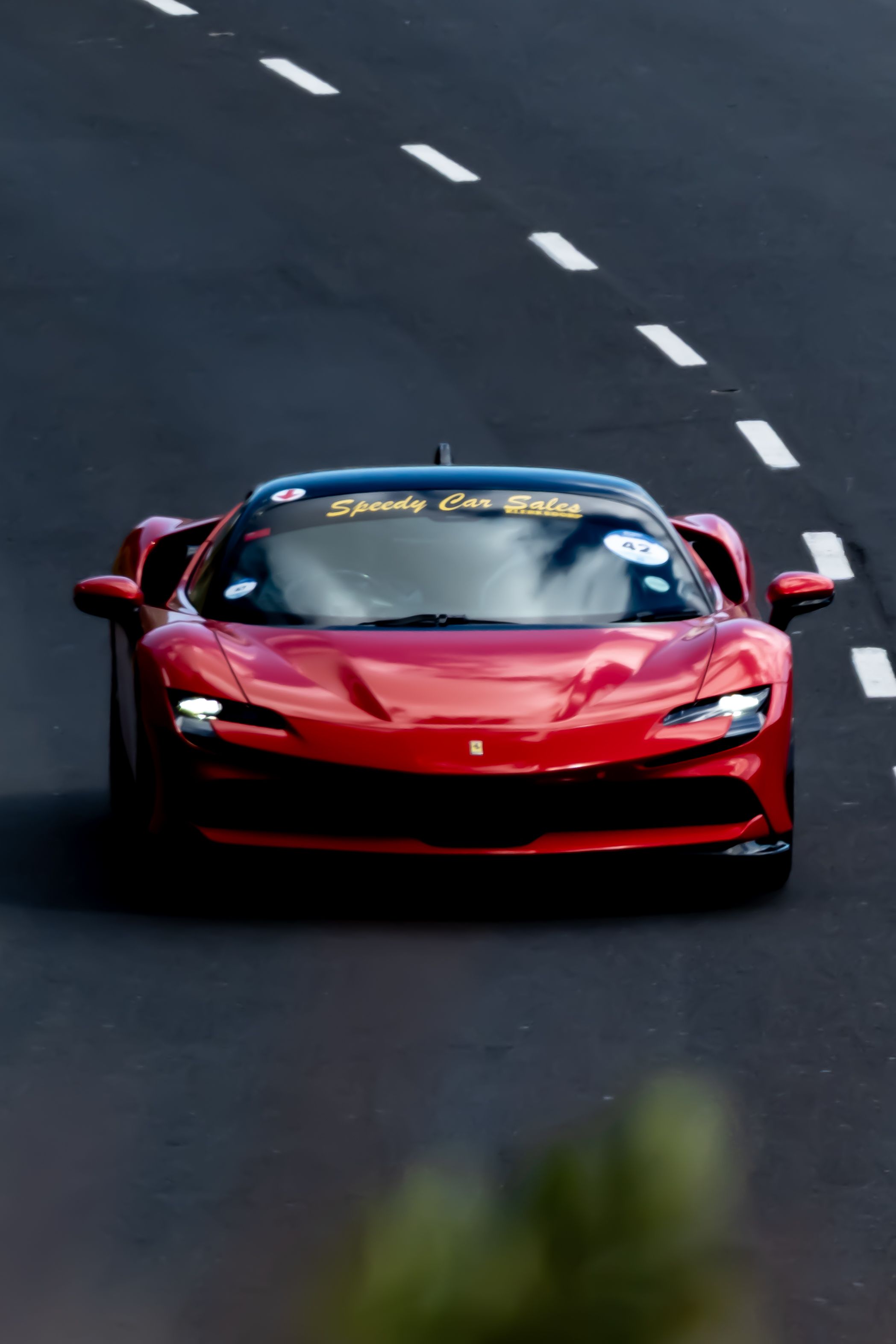 High-Speed Red Car Racing on Cape Town Road · Free Stock Photo