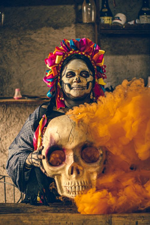 Free Catrina makeup and costume with vibrant skull, celebrated for Day of the Dead. Stock Photo
