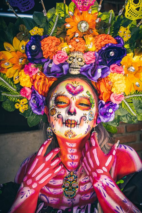 Free Colorful Catrina adorned with floral headdress for Dia de los Muertos in Mexico City. Stock Photo