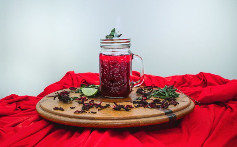 mason jar with black beans, corn, and avocado layers