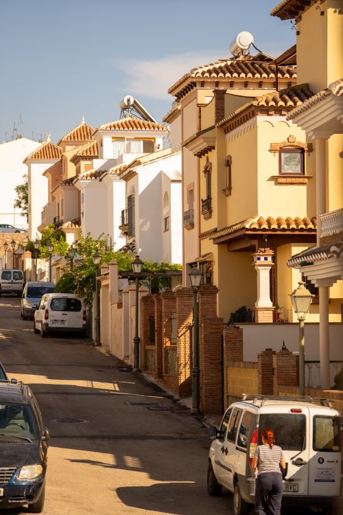 Free Charming street scene in Nerja, Spain showcasing traditional Andalusian architecture under a clear sky. Stock Photo