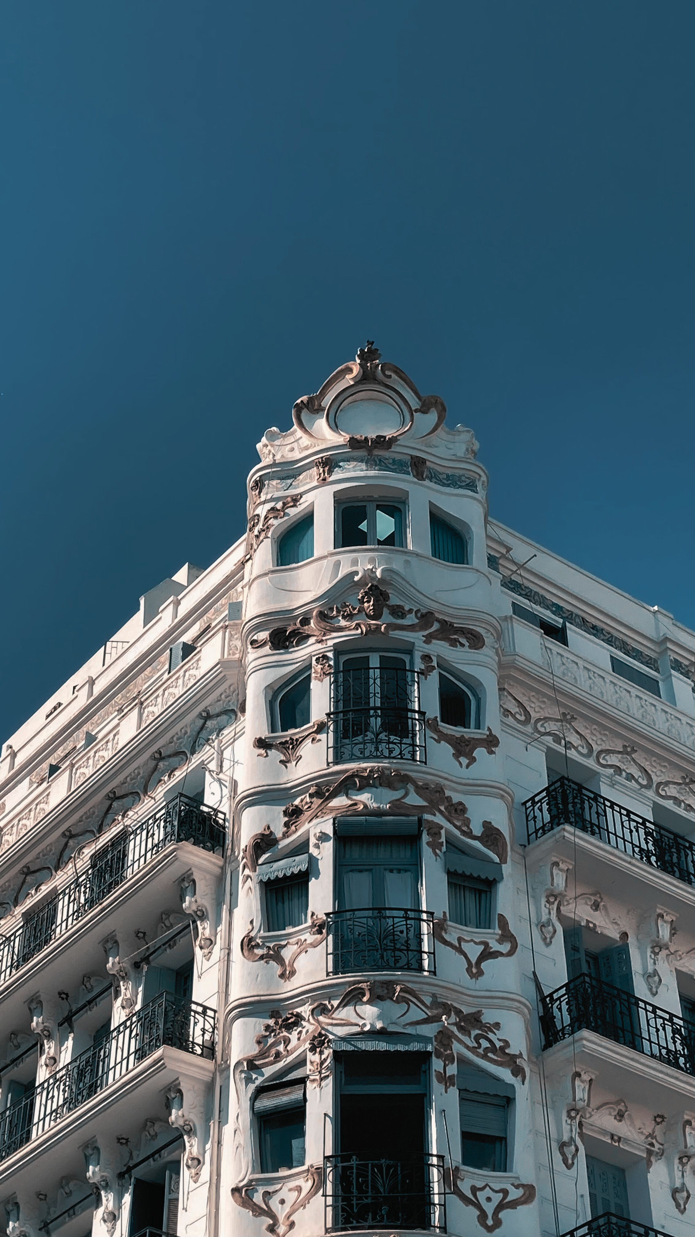 Ornate Classic Building Against Blue Sky · Free Stock Photo