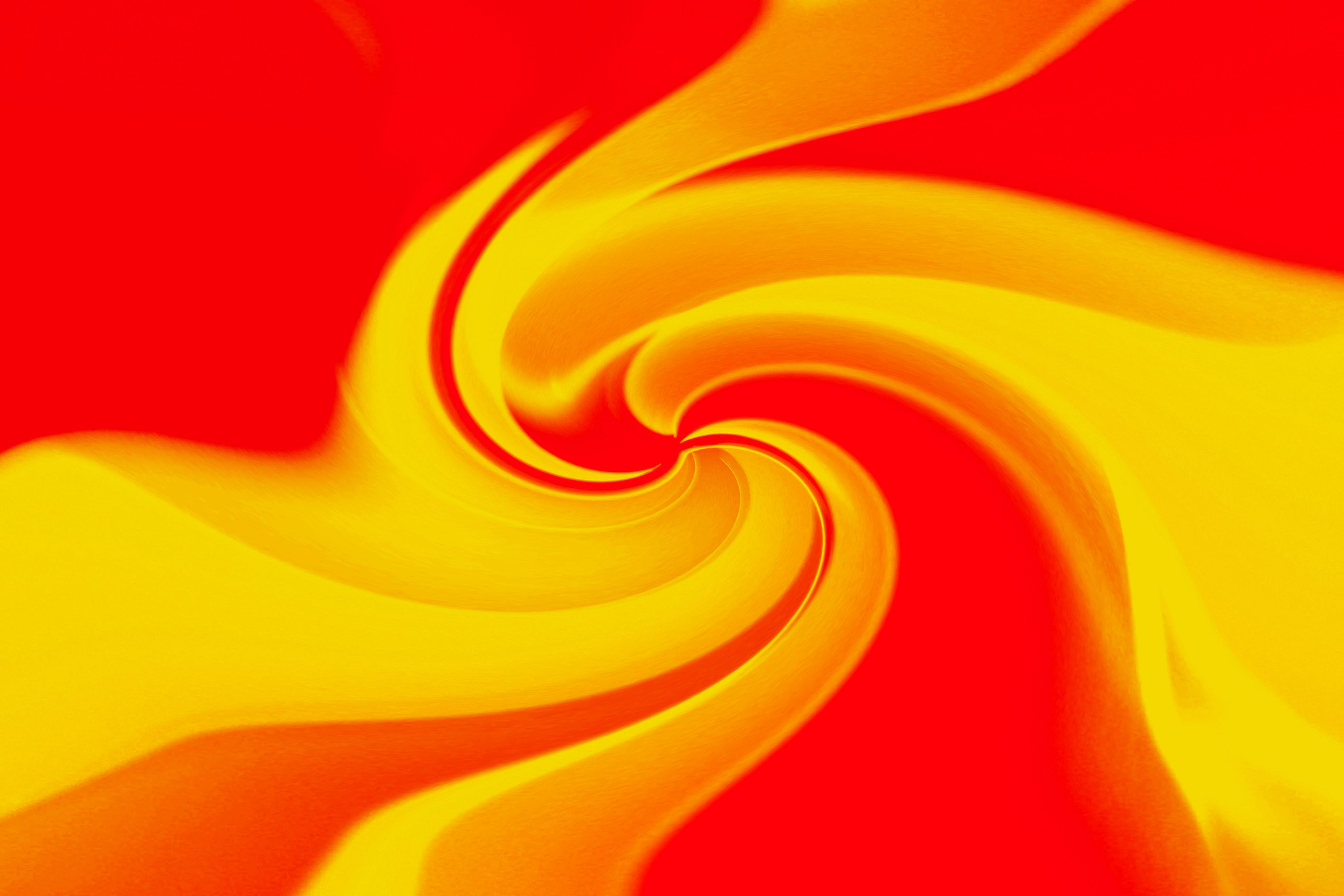 Vibrant Abstract Swirl with Red and Yellow Tones · Free Stock Photo