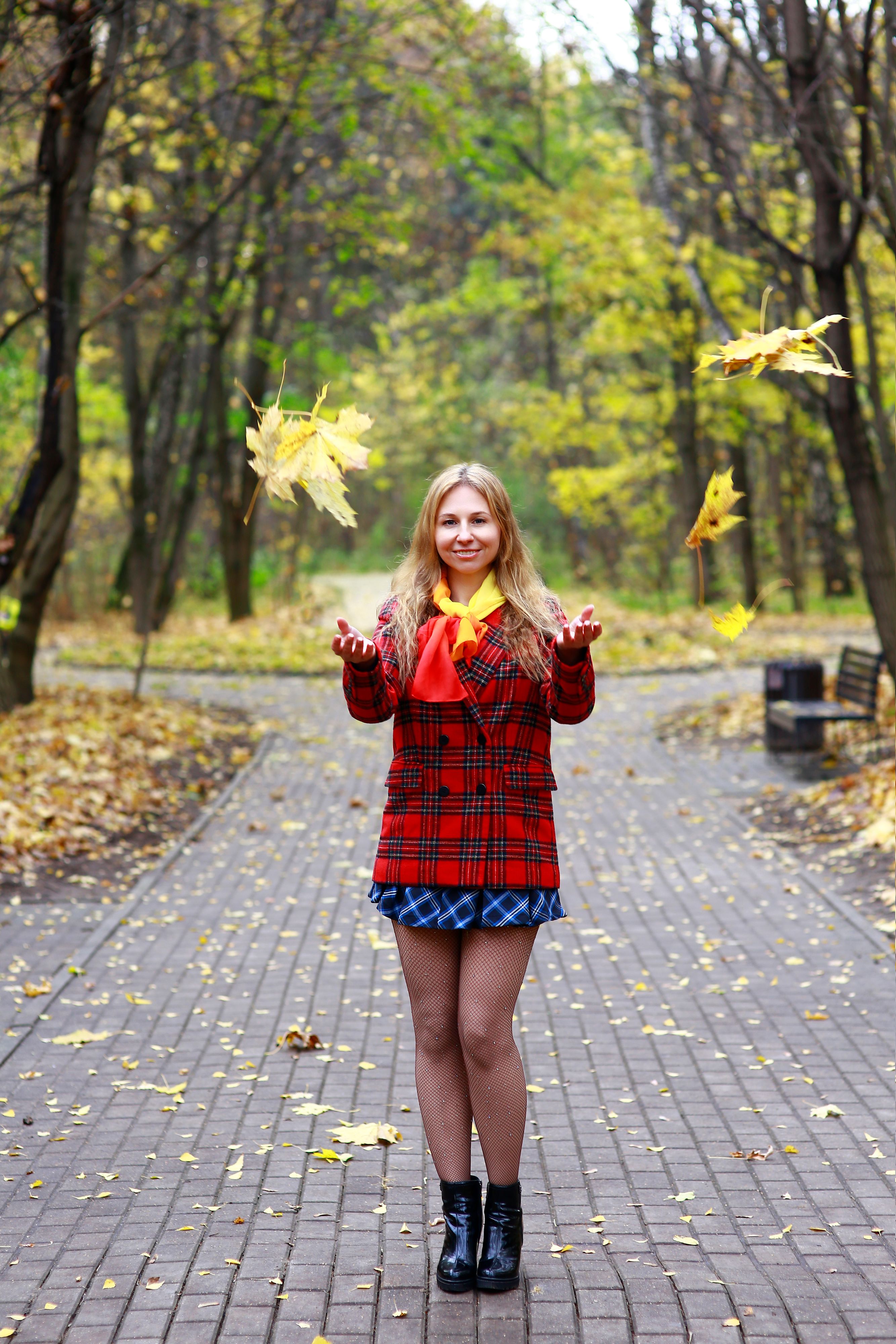 Young Woman in Autumn Park with Falling Leaves · Free Stock Photo
