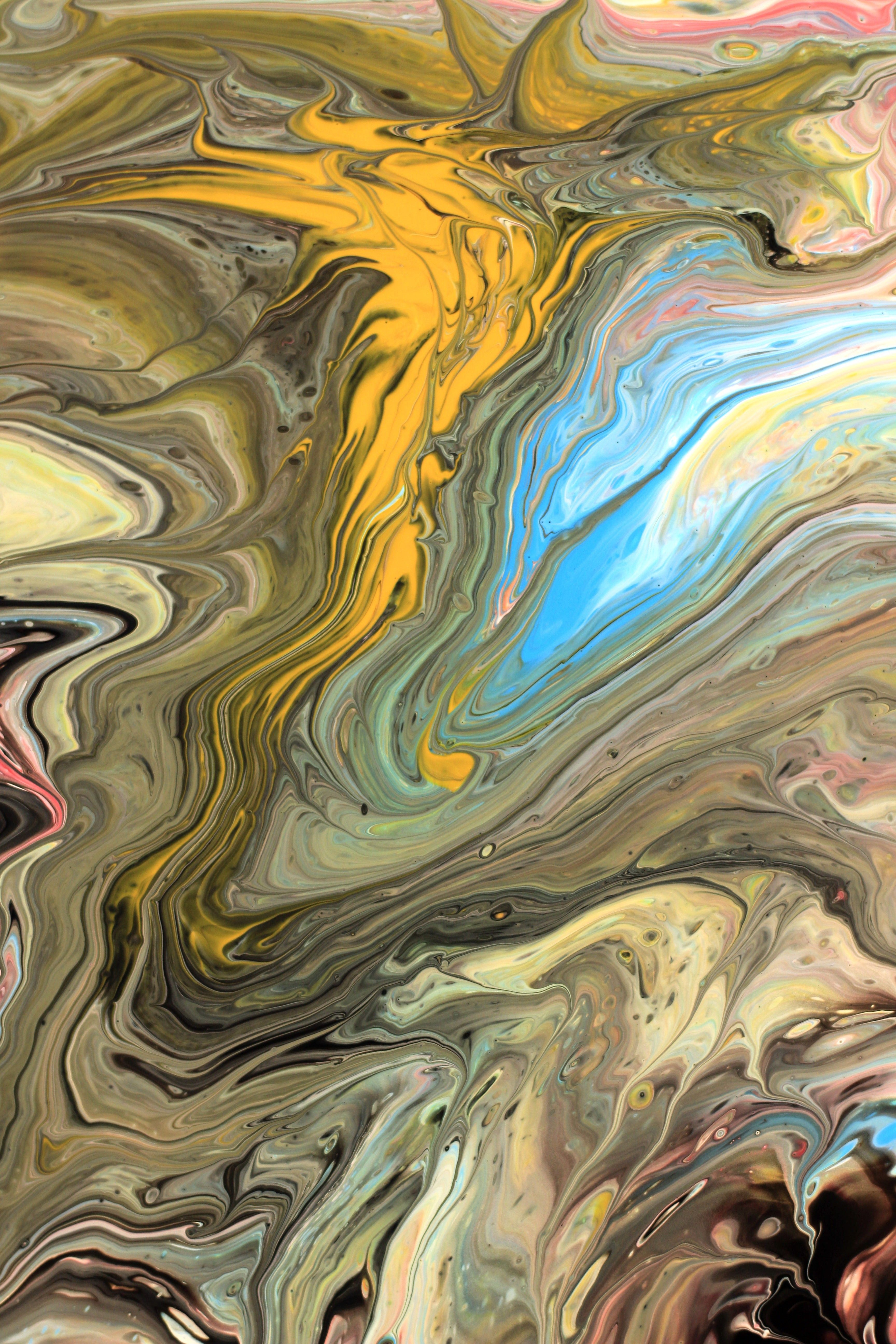 Dynamic abstract art with colorful swirling patterns creating a vibrant and fluid composition.