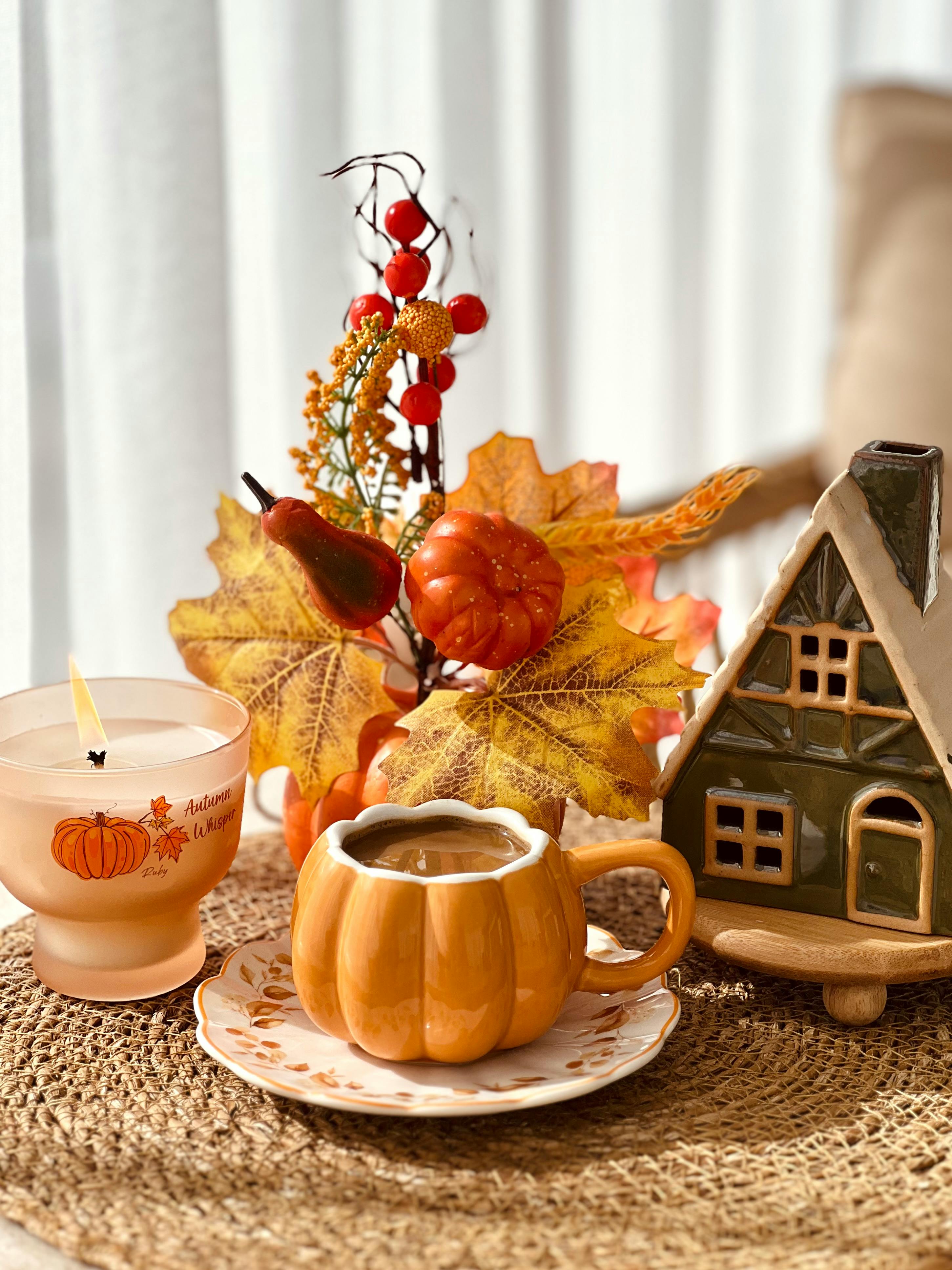 Cozy Autumn Coffee Scene with Pumpkin Decor · Free Stock Photo