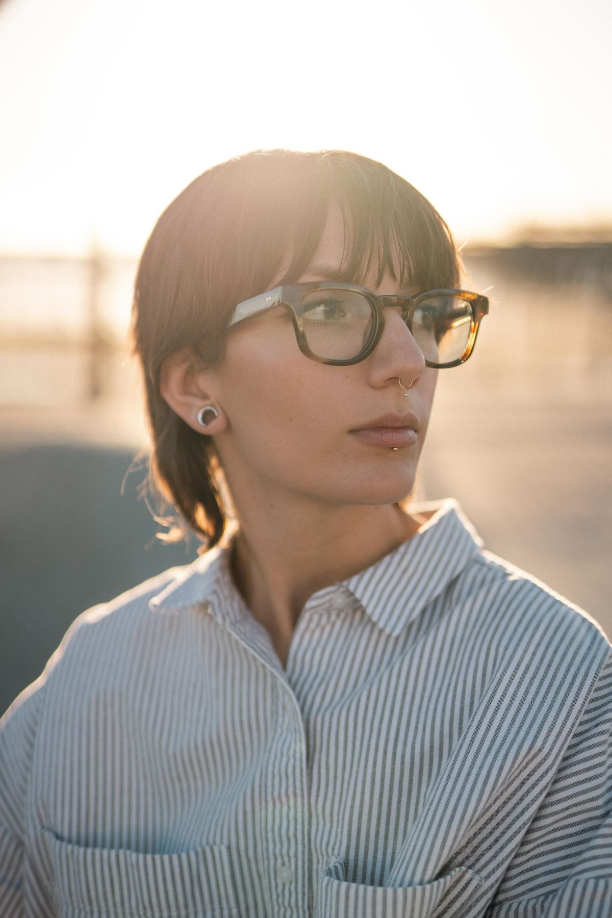 Woman wearing glasses at golden hour