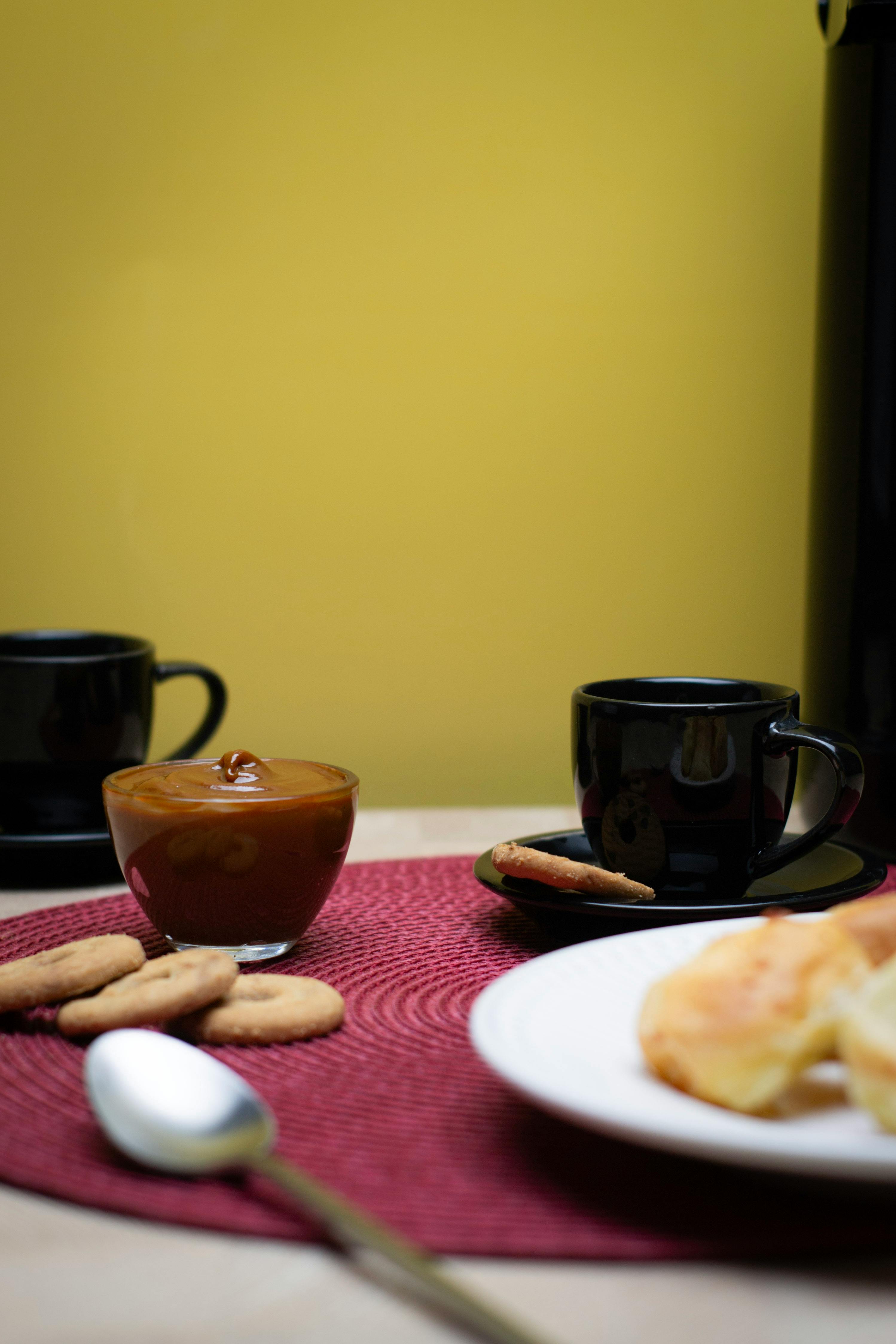 Enjoy a cozy coffee break with black coffee, cookies, and dulce de leche in São Paulo.