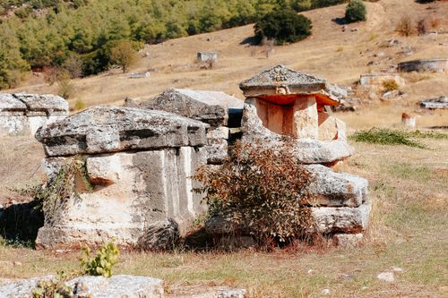 Free Explore ancient stone tombs in the serene landscape of Hierapolis, Turkey. Stock Photo