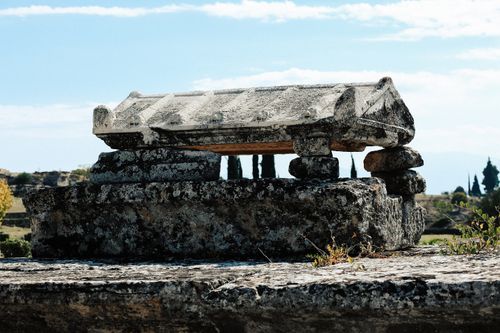 Free Explore the ancient stone tomb in Hierapolis with its historic stone masonry under clear skies. Stock Photo