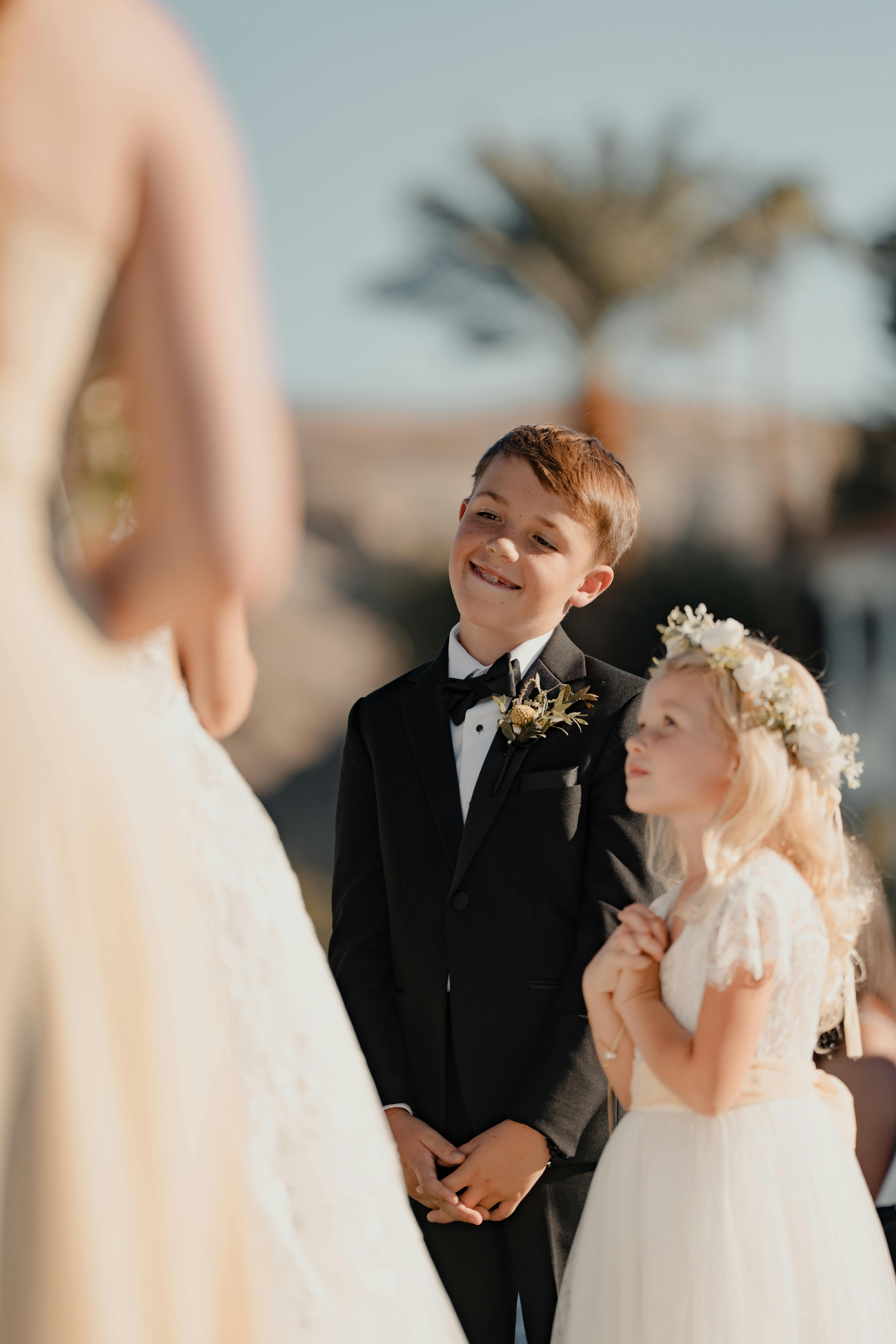 Smiling kids at an outdoor wedding in Las Vegas, capturing love and celebration.