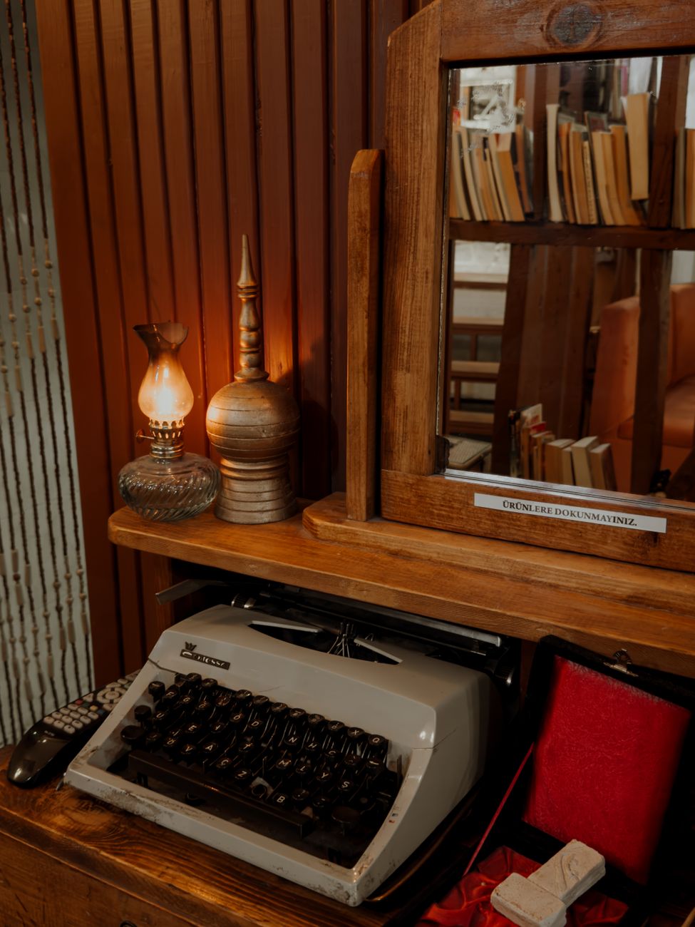 A vintage typewriter set against a warm wooden interior with antique decor elements, evoking nostalgia.