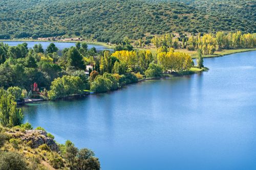 Free Aerial view of lush greenery and serene waters at Lagunas de Ruidera, Spain. Stock Photo