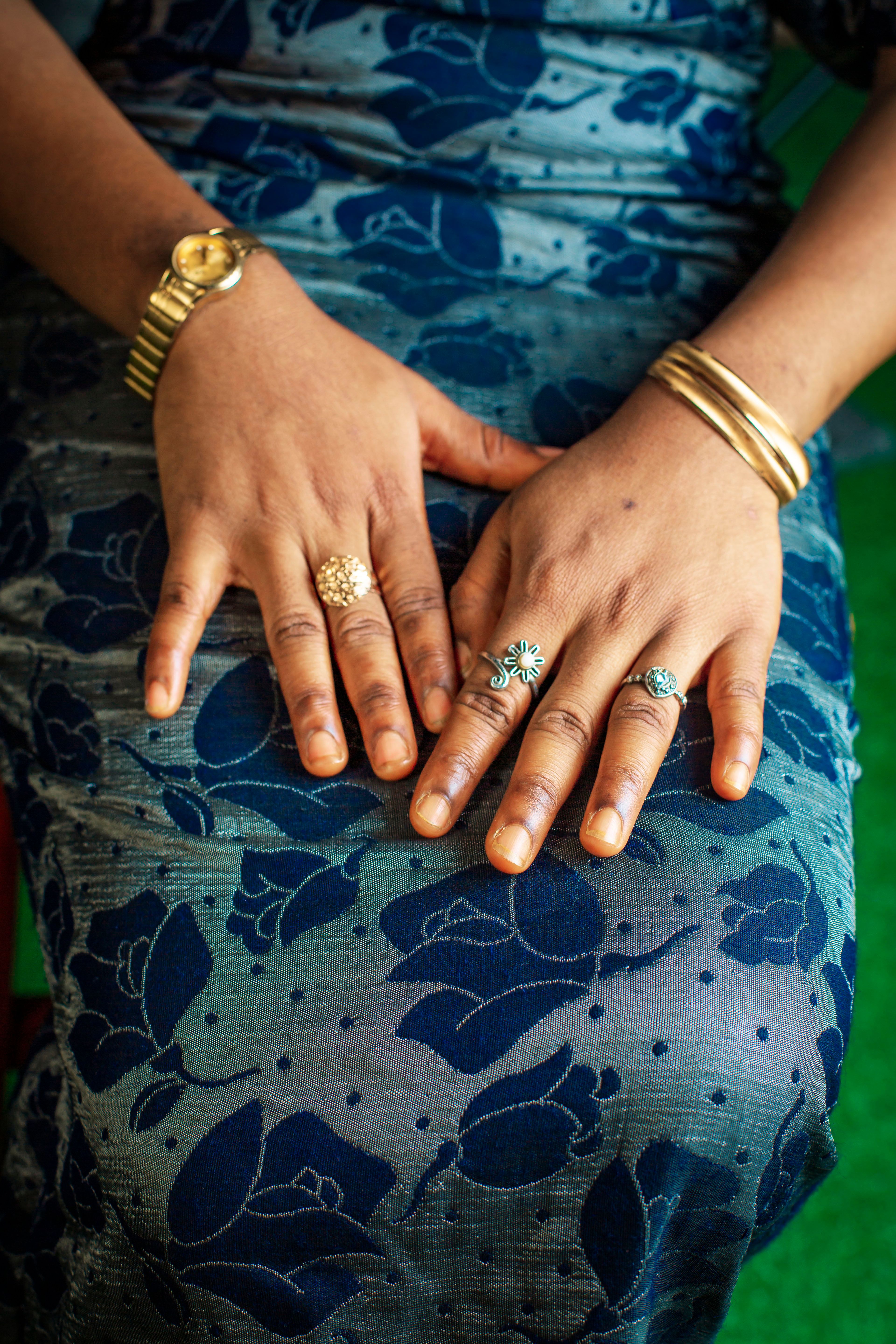 Elegant Hand Jewelry on Floral Dress  Free Stock Photo