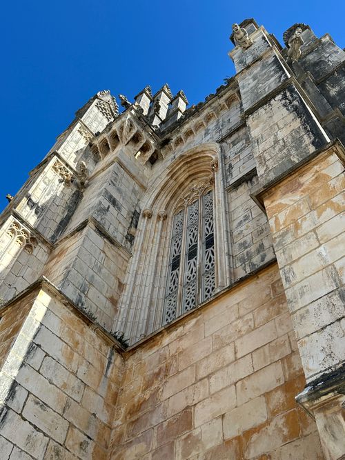 Free A stunning view of the Gothic Batalha Monastery under a clear blue sky. Stock Photo