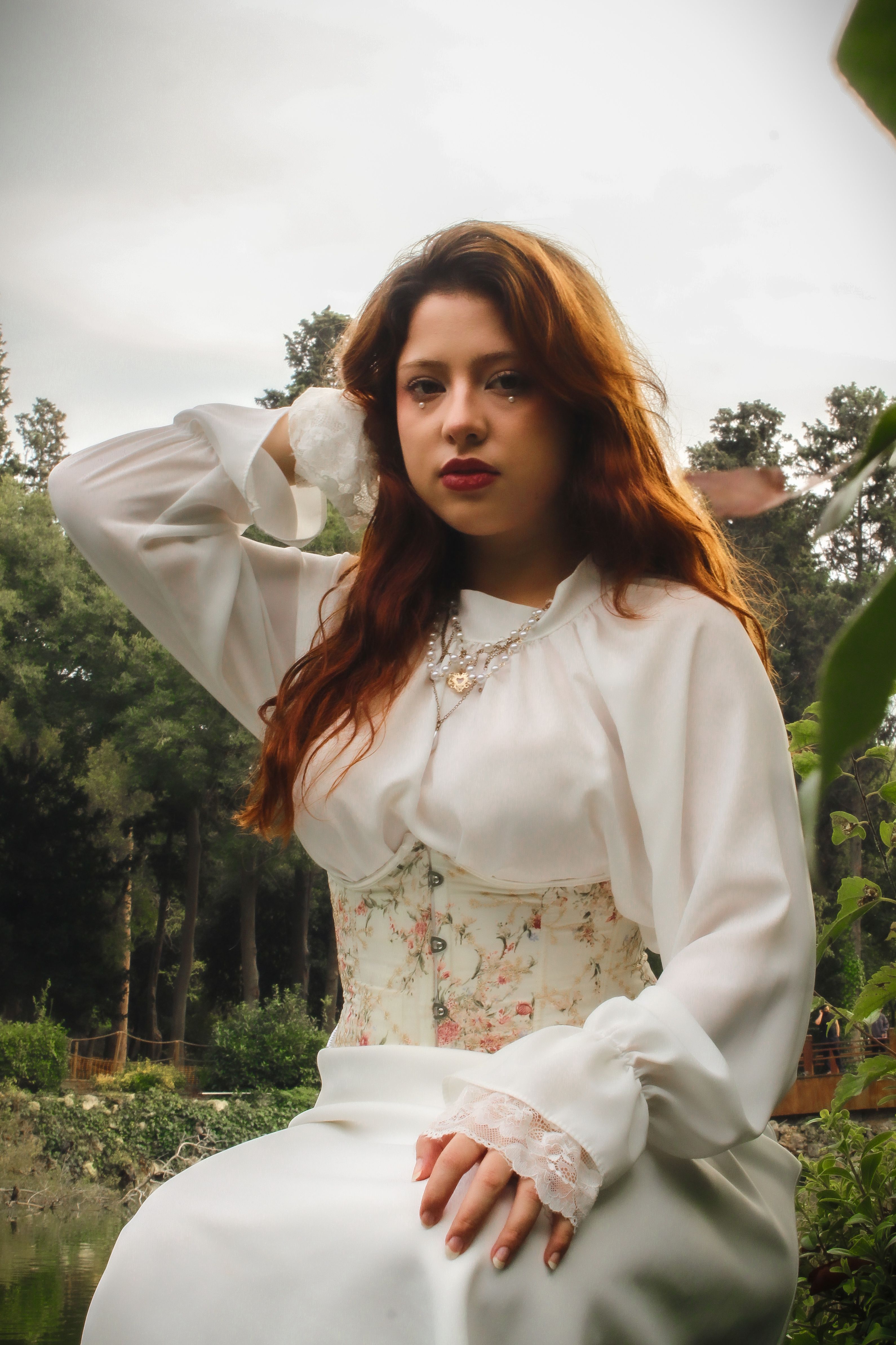 A woman in a Victorian-style dress poses gracefully outdoors, exuding elegance and timeless beauty.. pexels, woman, victorian