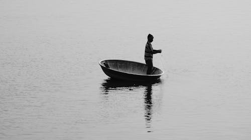 Man Standing on Boat