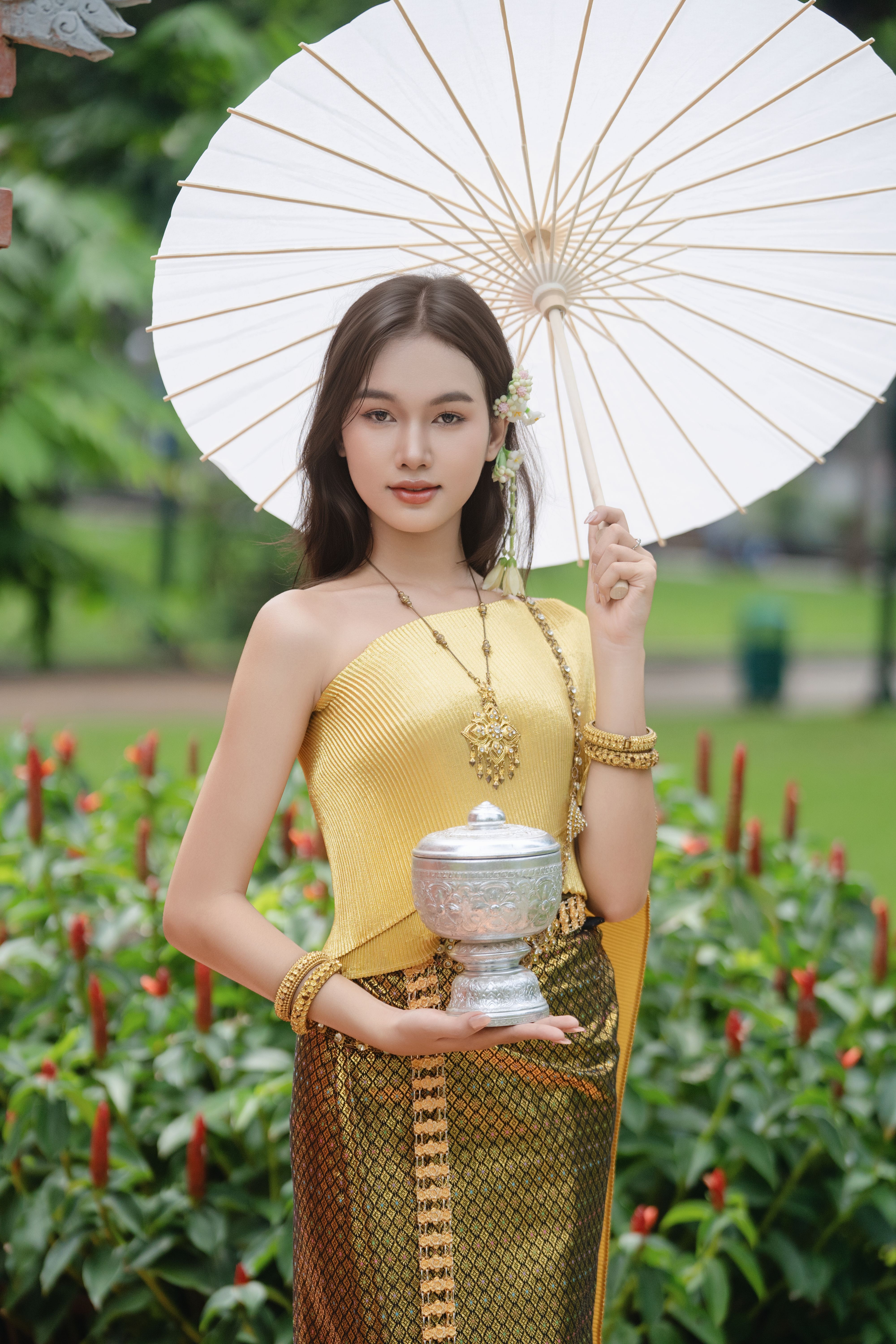Elegant Woman in Traditional Thai Attire Outdoors  Free Stock Photo