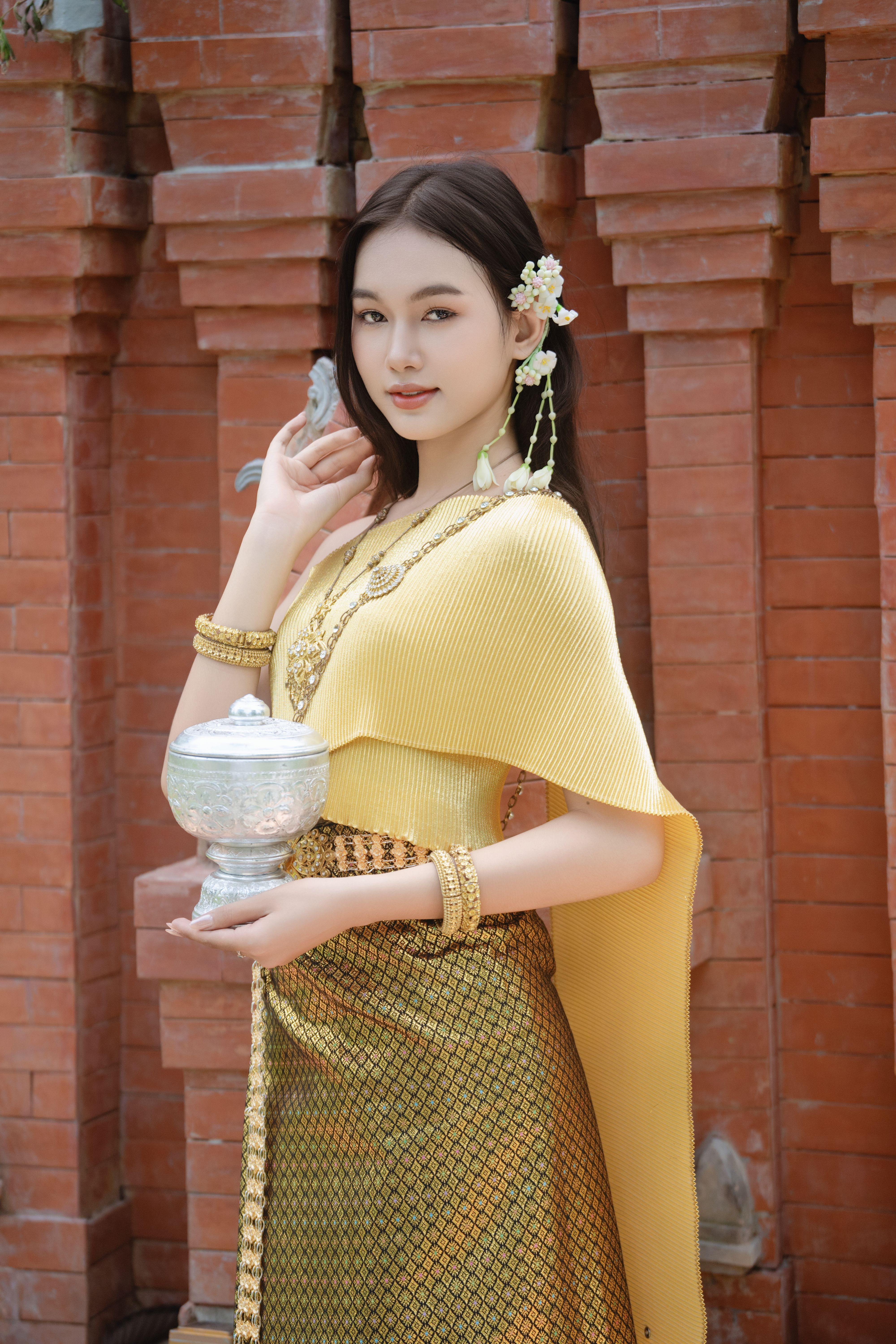 A Woman in Gold Traditional Dress  Free Stock Photo