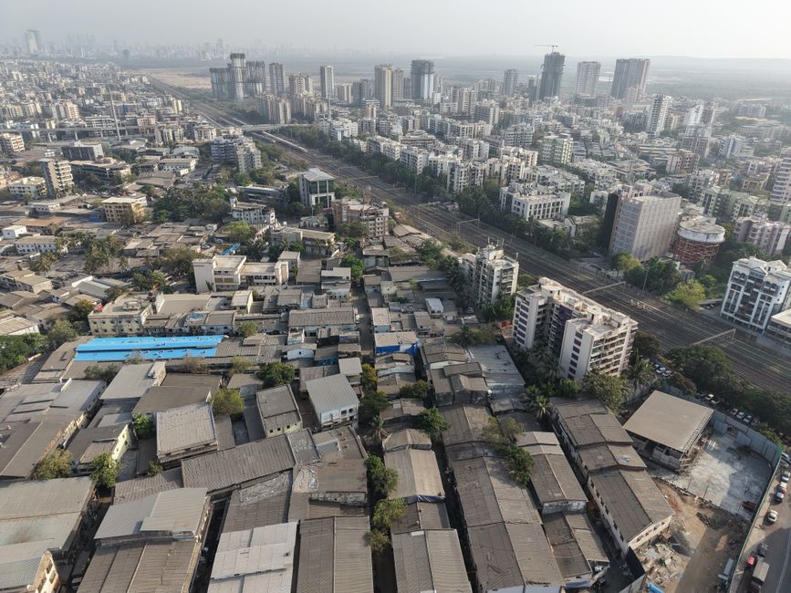 Aerial view of a bustling urban landscape in Mumbai, showcasing city architecture and skyline.
