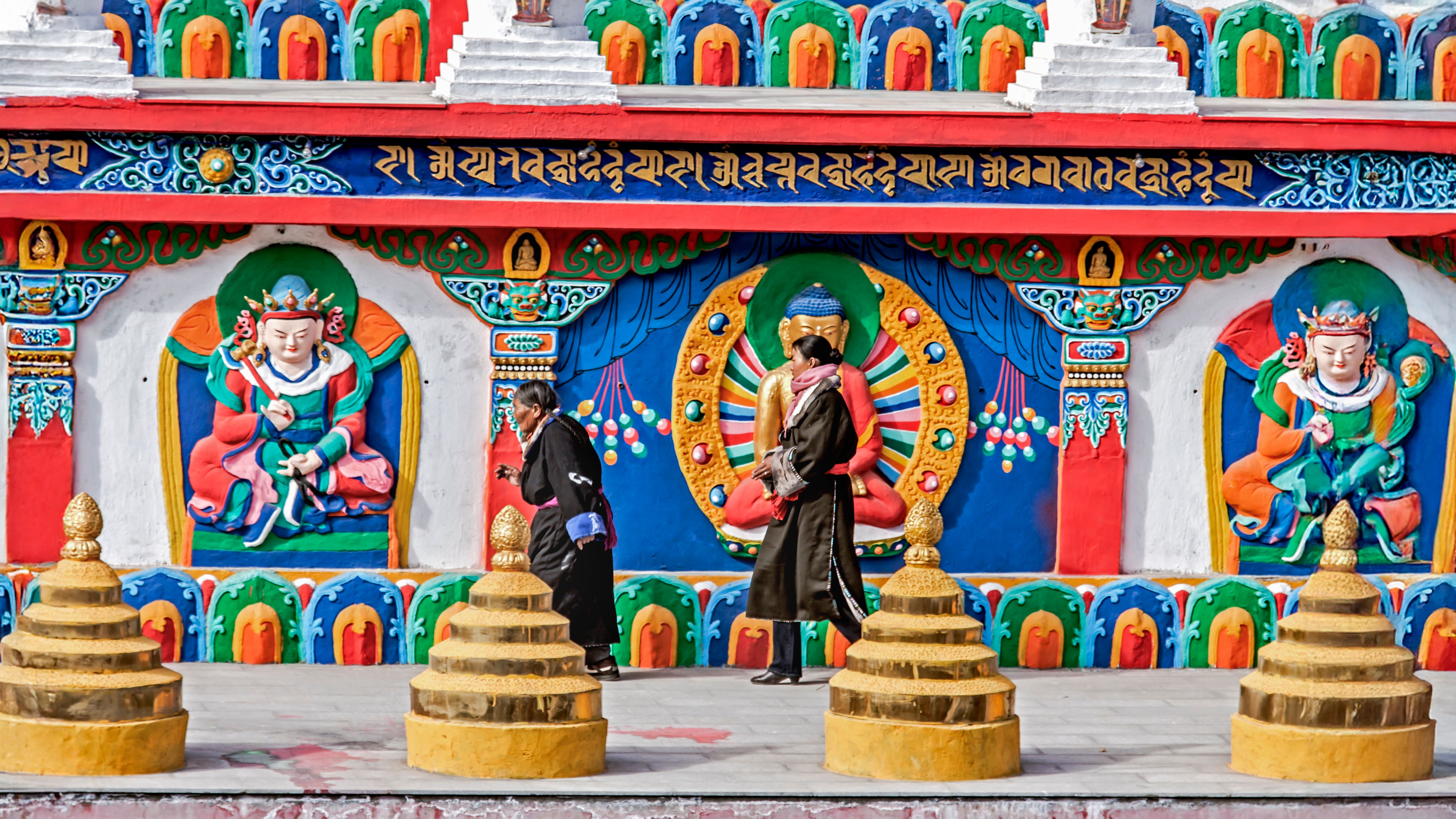 Tibetan Buddhist monastery with prayer flags in the mountains — detail