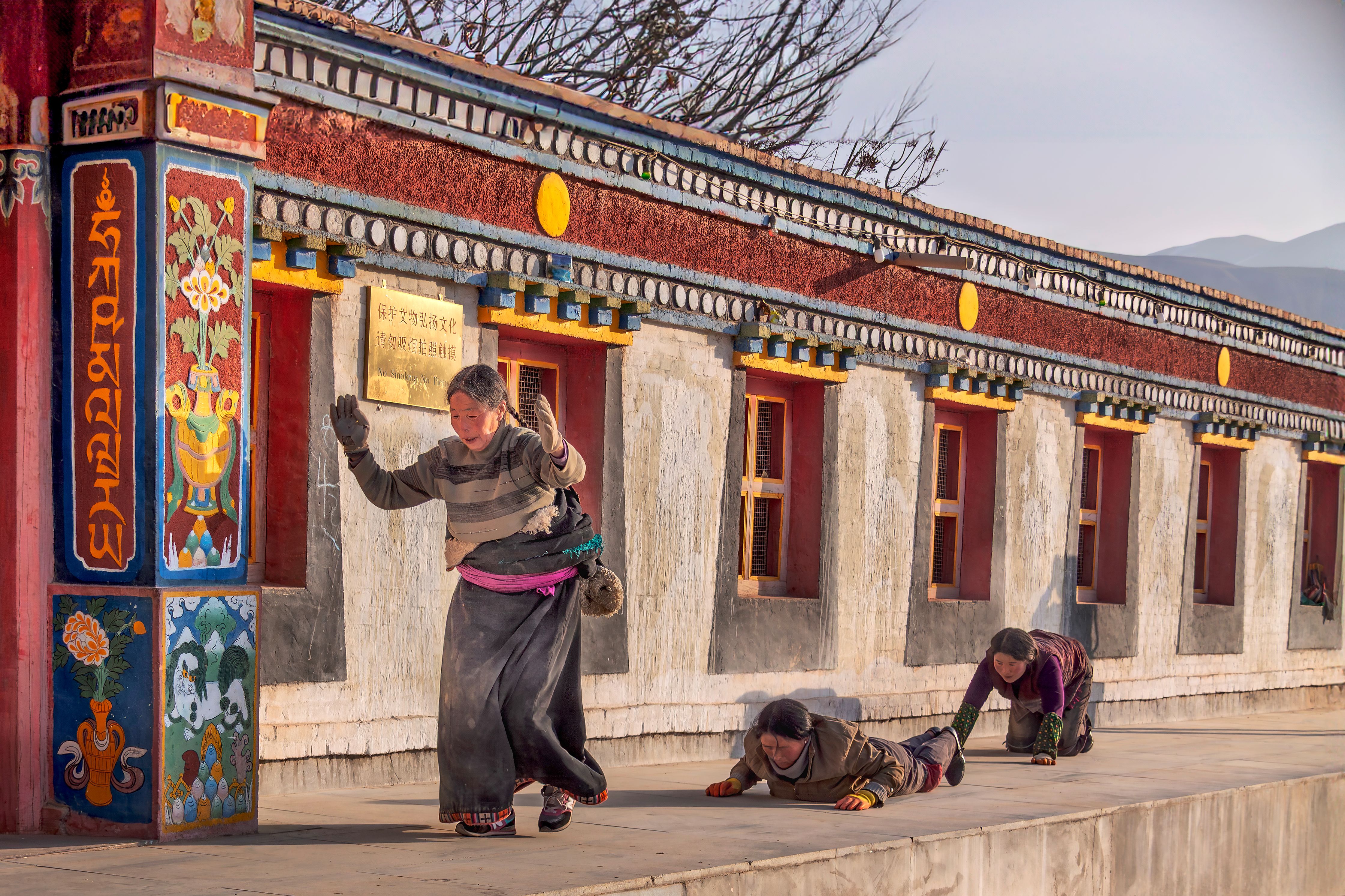 Tibetan Pilgrims Performing Spiritual Prostration · Free Stock Photo