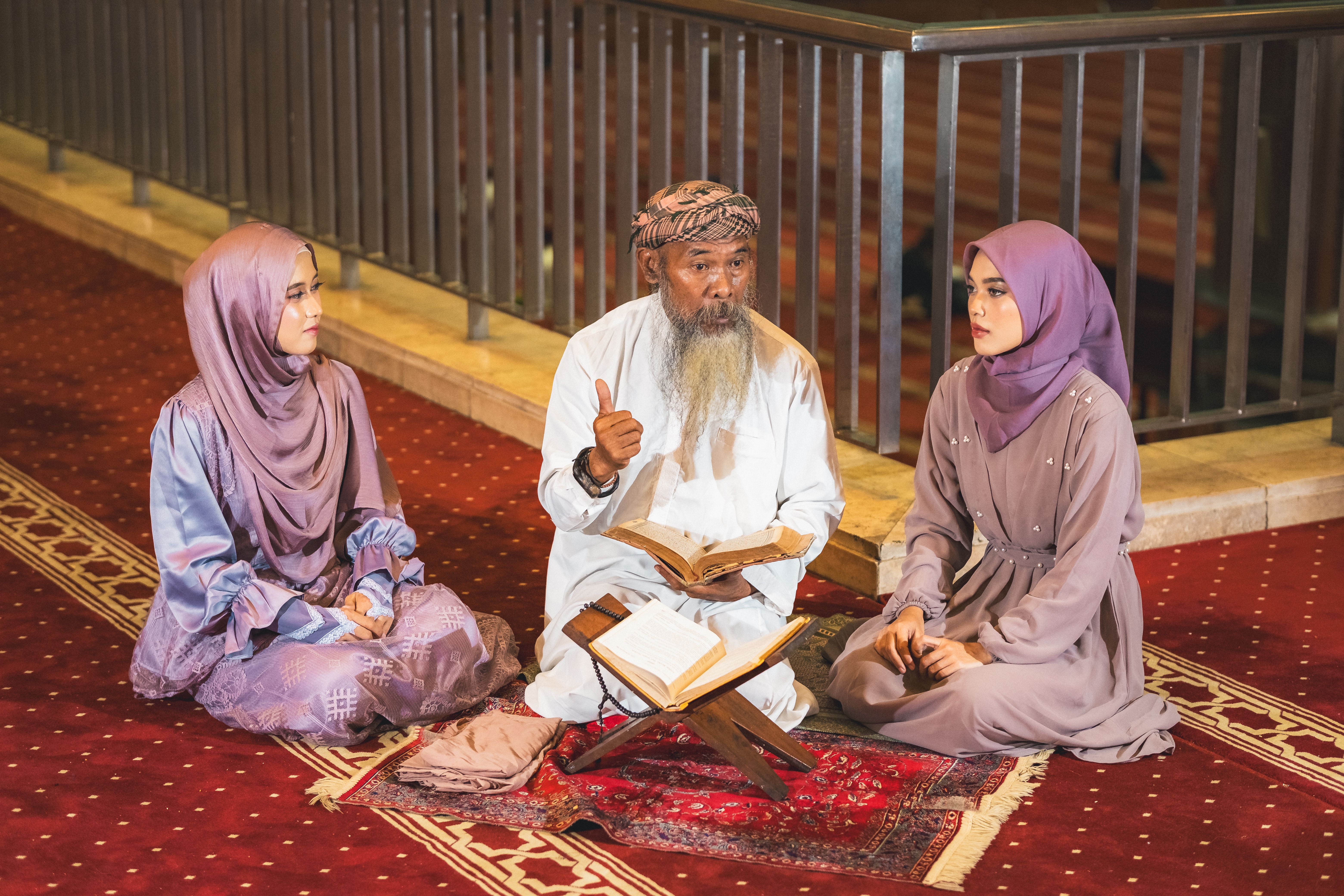Three Muslims Engaged in Quranic Study at the Mosque · Free Stock Photo