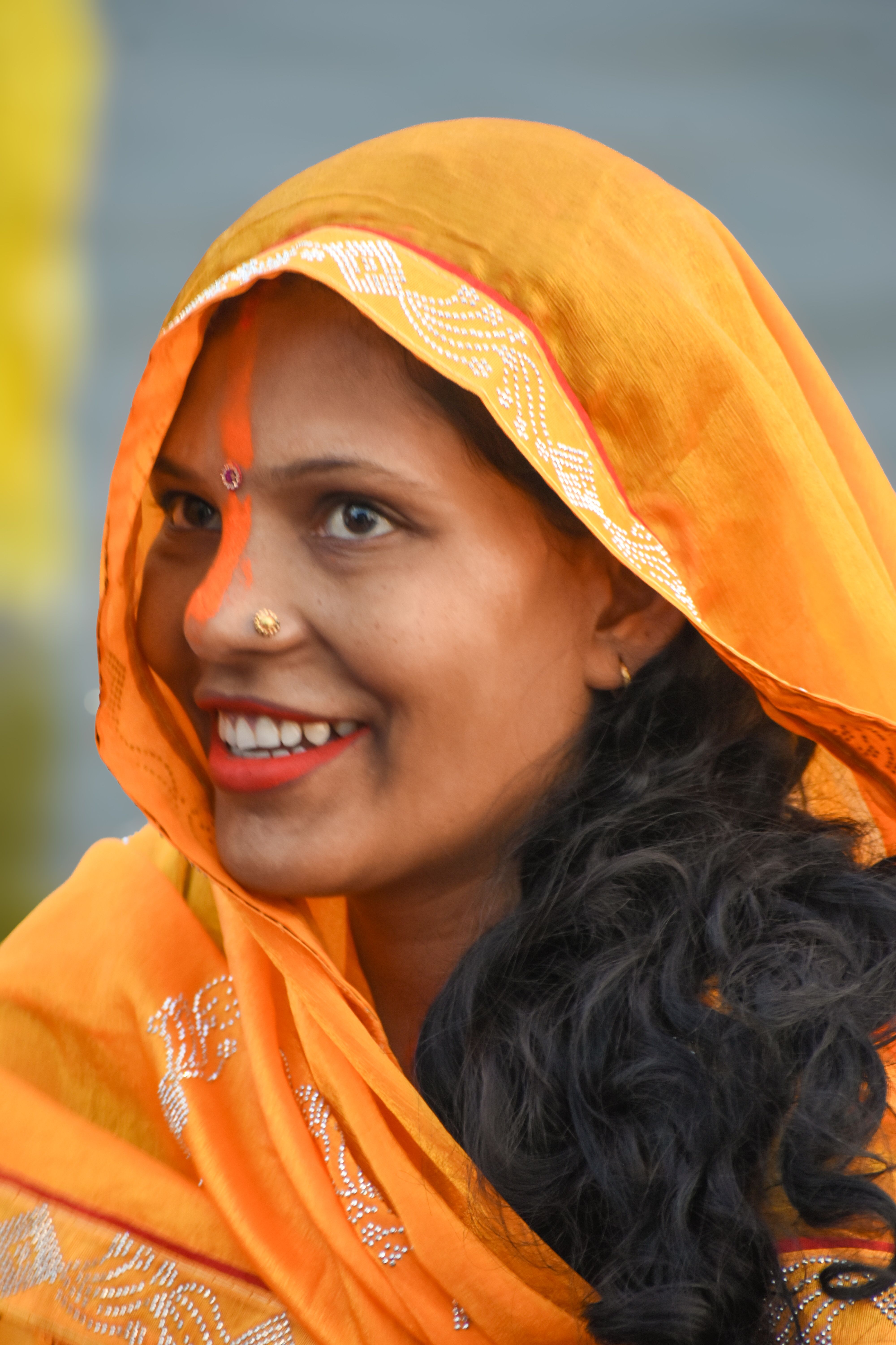 Portrait of a Smiling Woman in Traditional Attire · Free Stock Photo