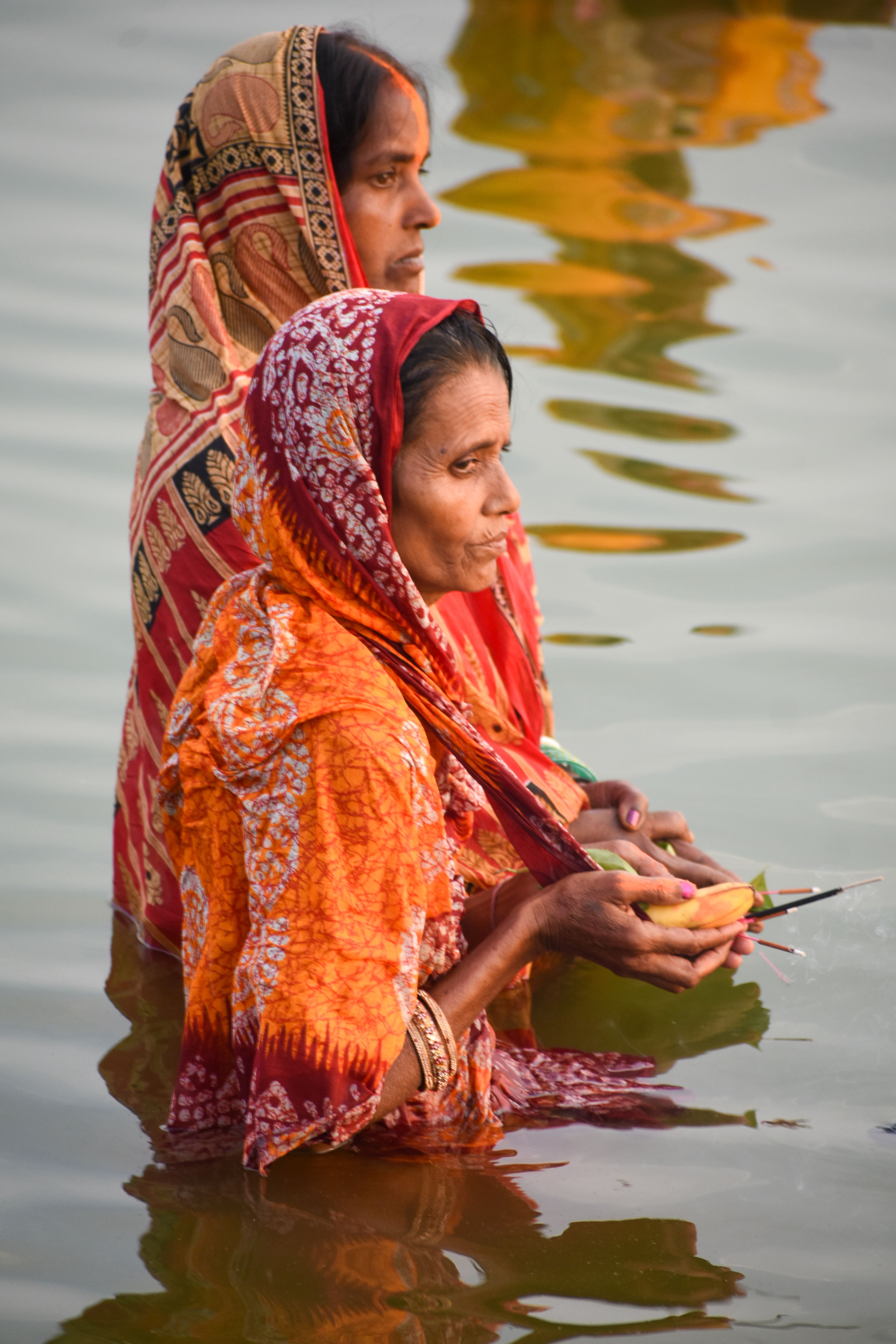Women Participating in a River Ritual Ceremony · Free Stock Photo