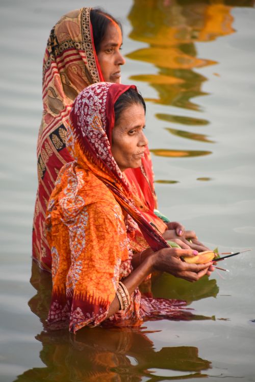 Women Participating in a River Ritual Ceremony · Free Stock Photo