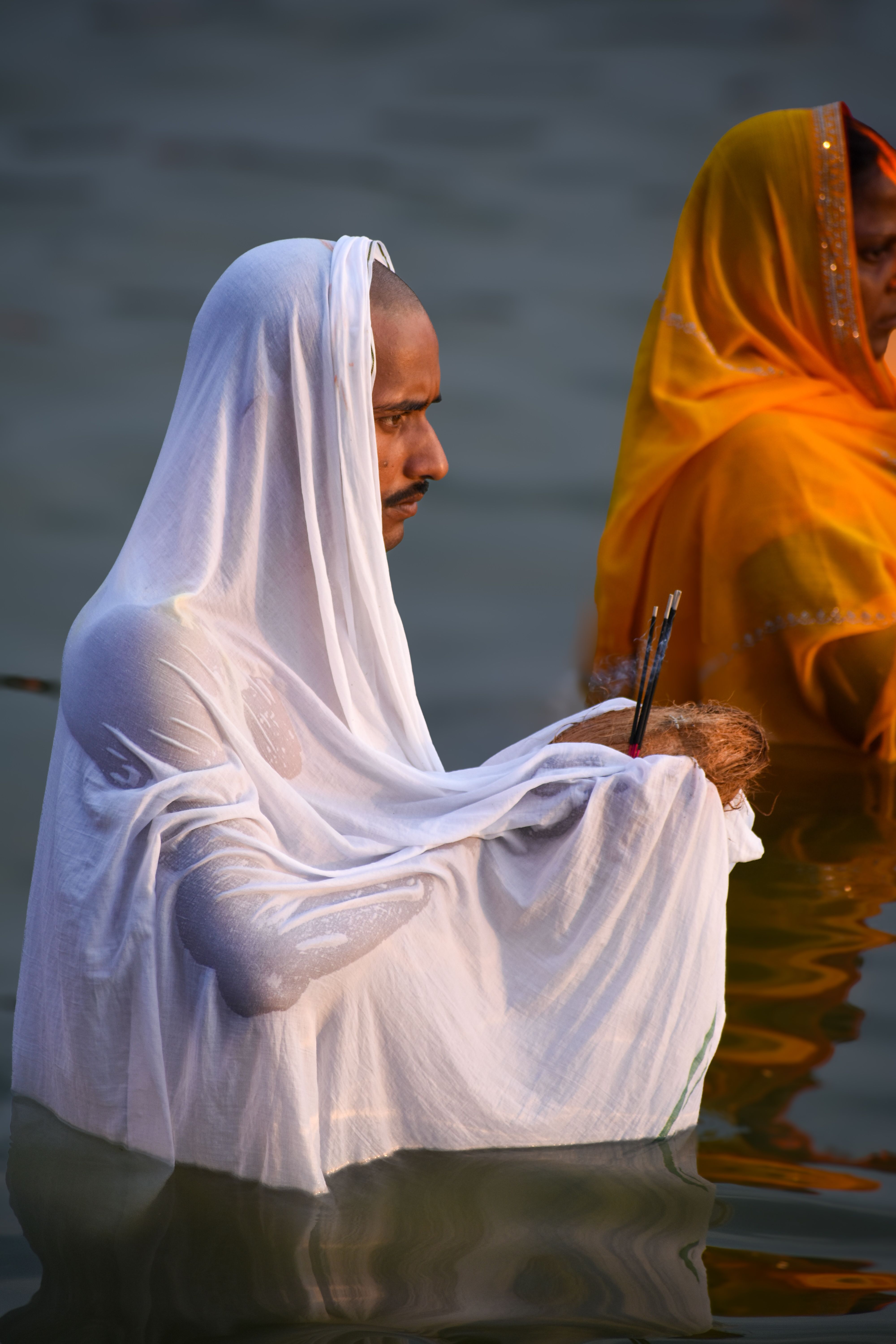 Man Holding Kali Mask and Taking Ritual Bath in Ganges River · Free ...