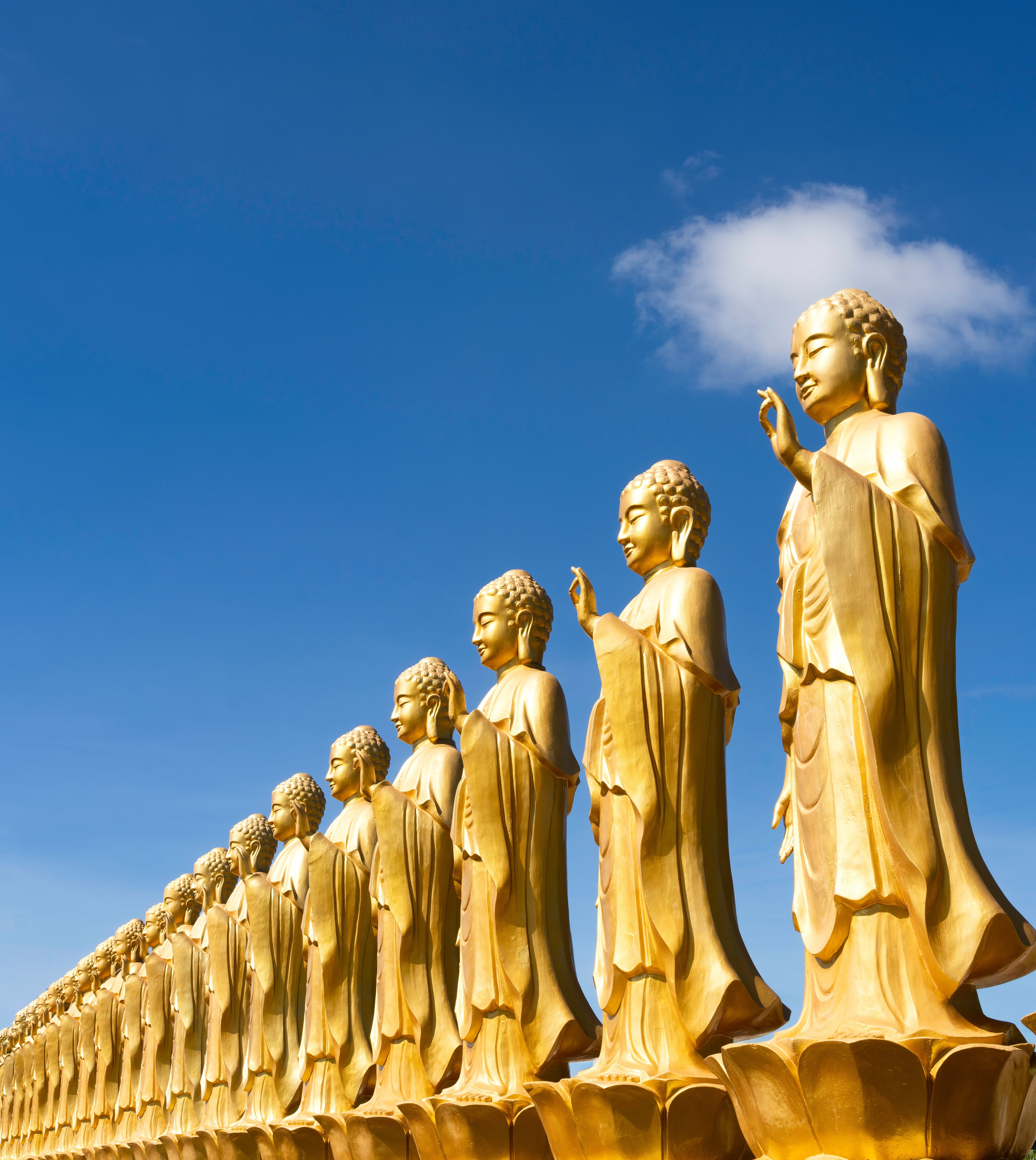 Golden Buddha Statues Under Clear Blue Sky · Free Stock Photo