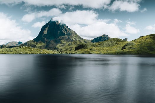 Majestic Pic du Midi d'Ossau reflected on a serene lake in the Pyrenees.