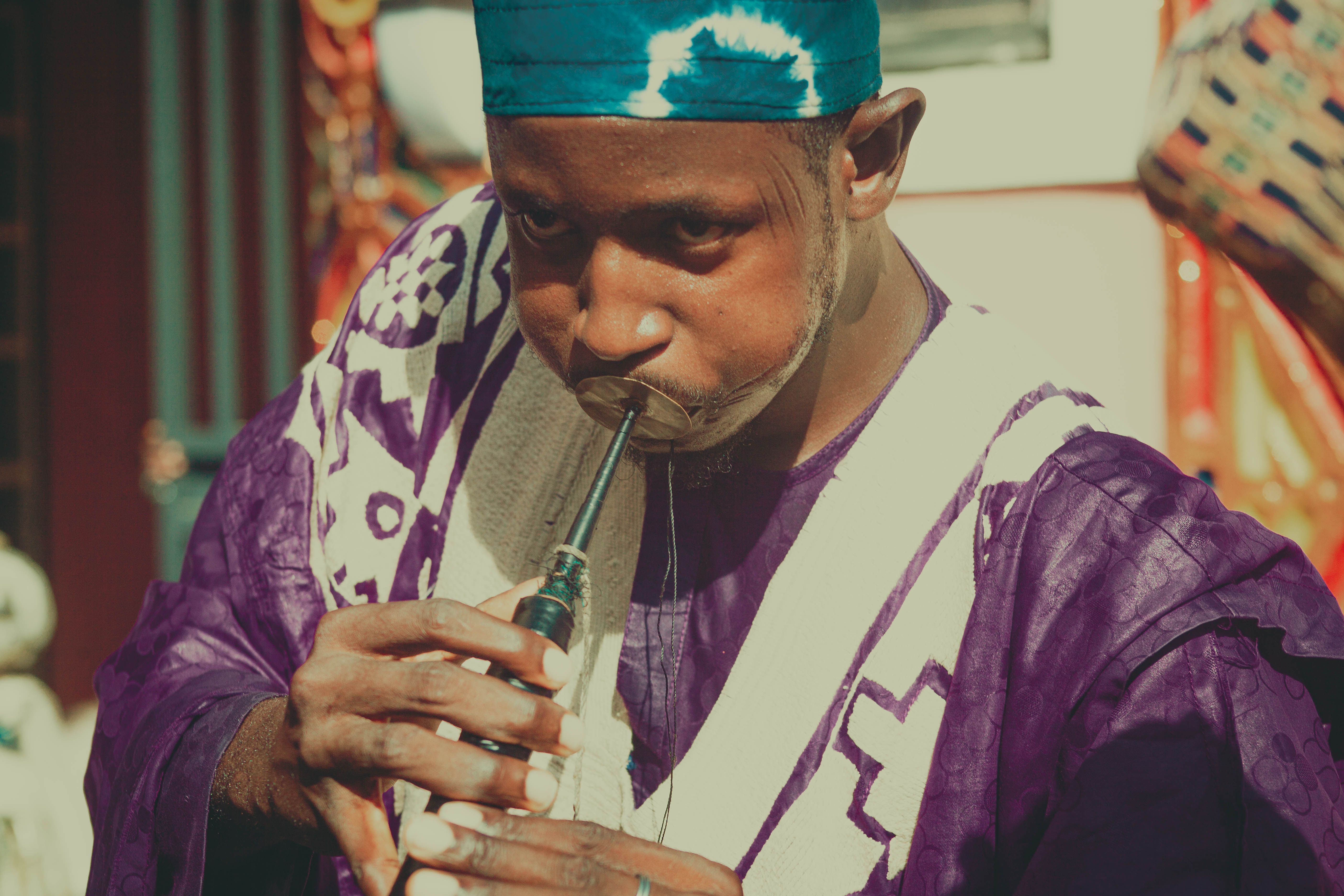 Colorful Traditional Musician Playing Instrument · Free Stock Photo