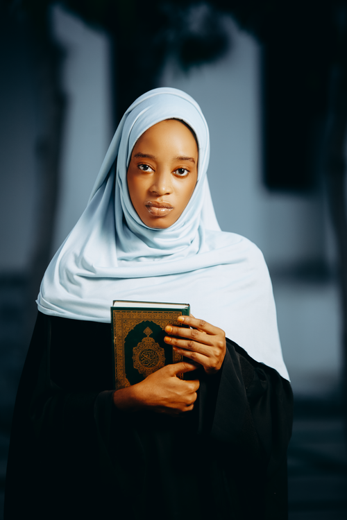 Young Woman in Hijab Reading a Book Portrait · Free Stock Photo