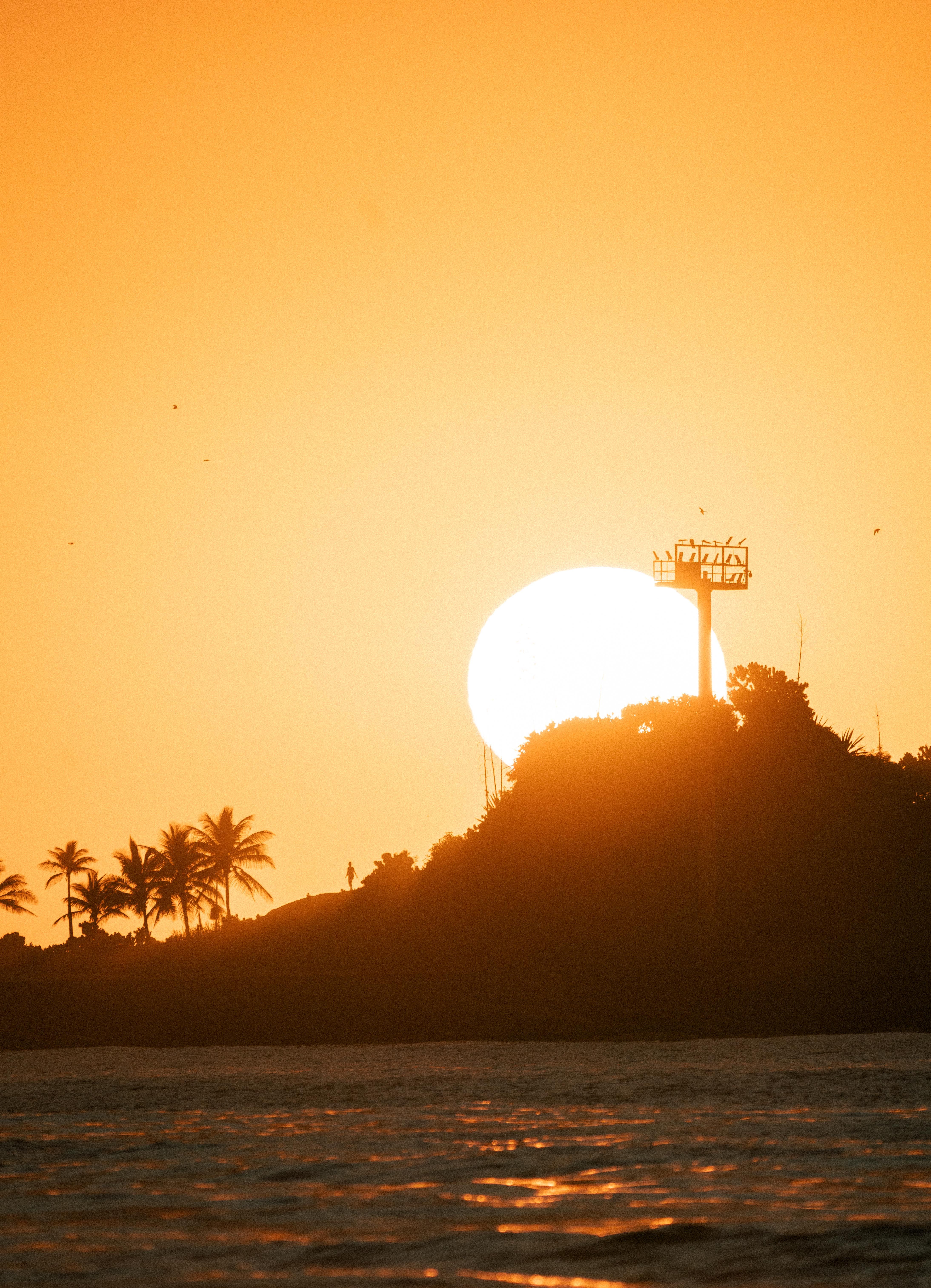 Stunning Sunset Behind Tropical Island Silhouette · Free Stock Photo