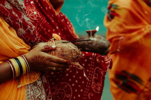 Free Women performing Chhath Puja with offerings in Lucknow, showcasing vibrant cultural traditions. Stock Photo