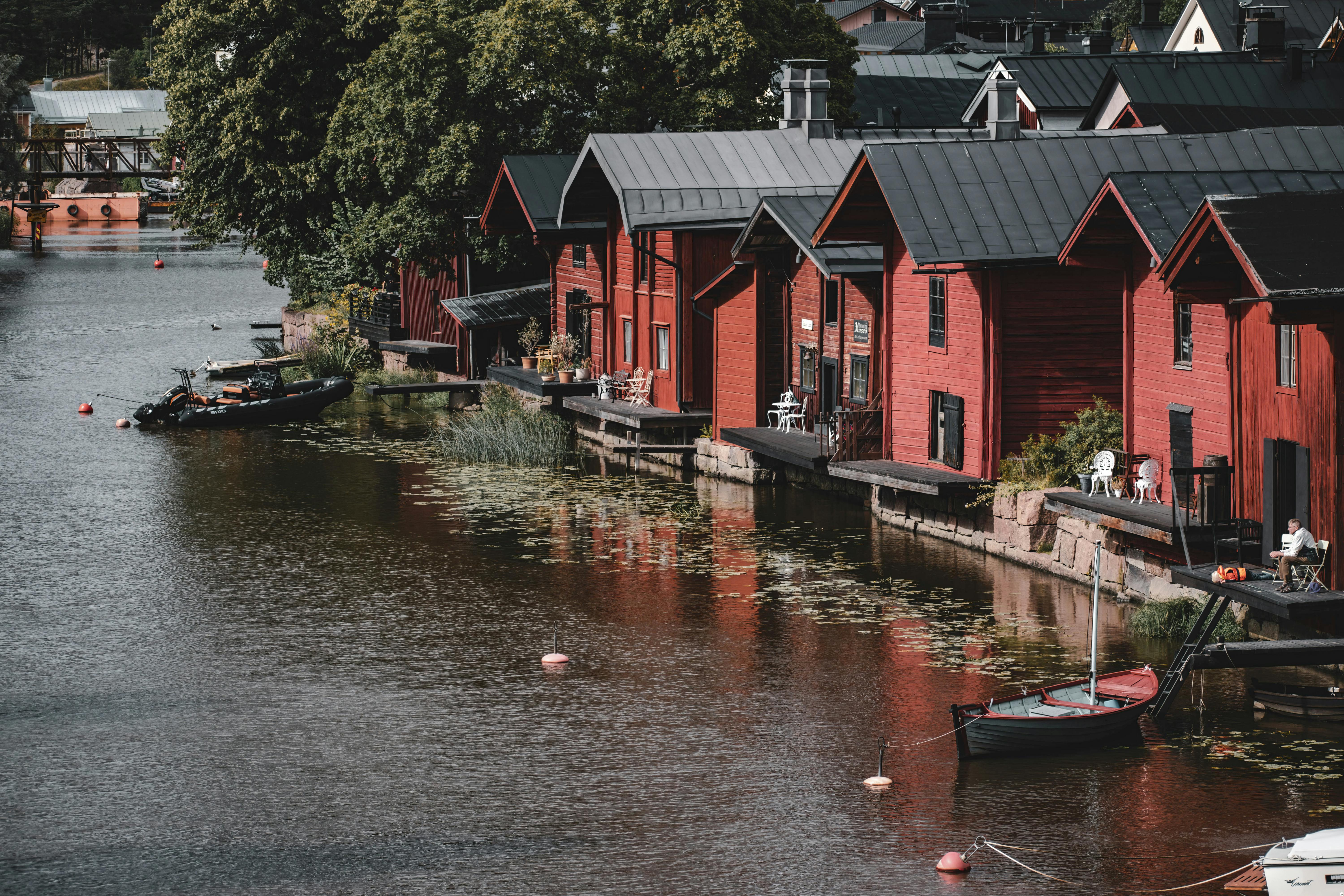 Scenic Riverside View of Historic Red Warehouses in Porvoo, Finland