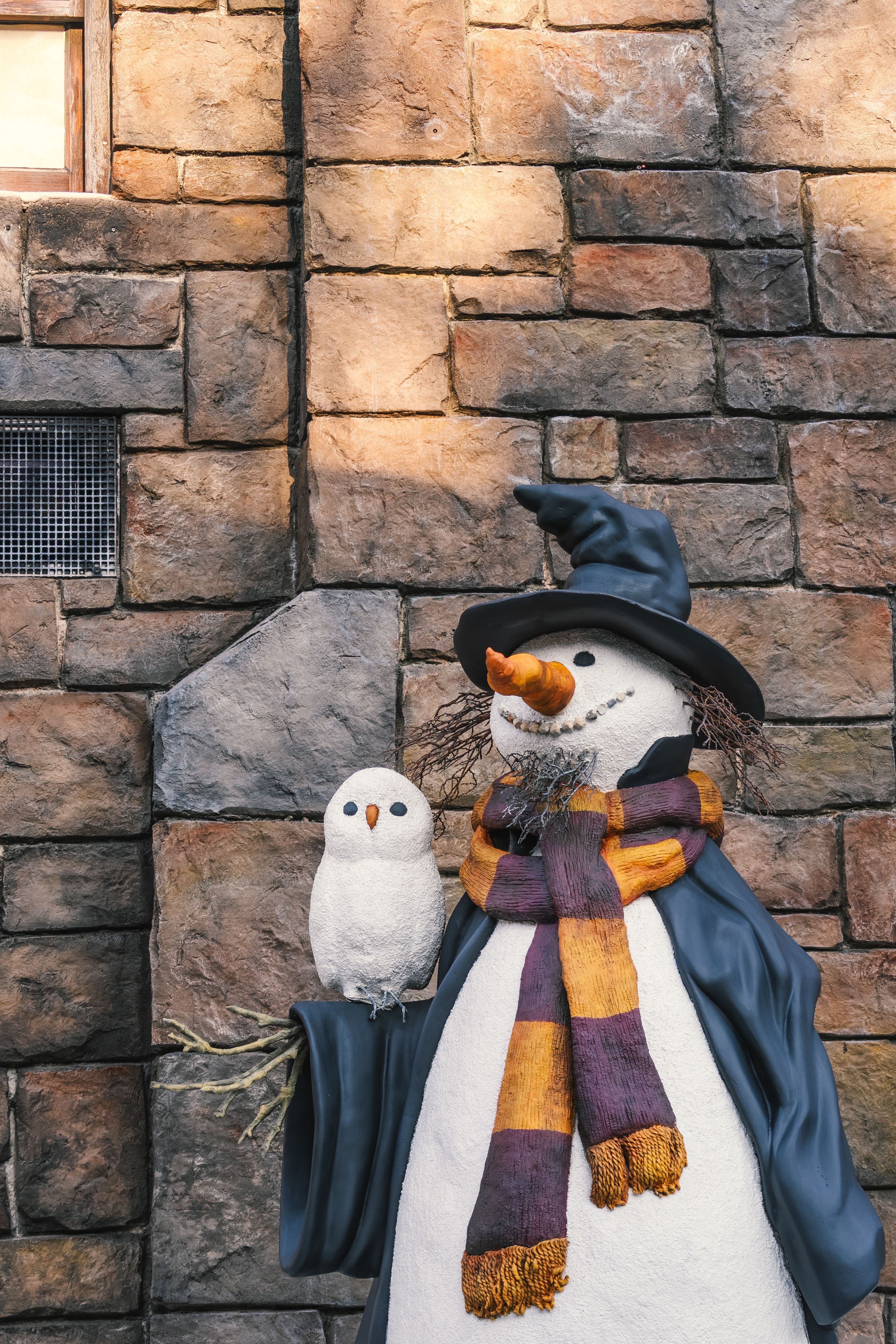Festive Snowman and Owl Sculpture in Winter Setting · Free Stock Photo