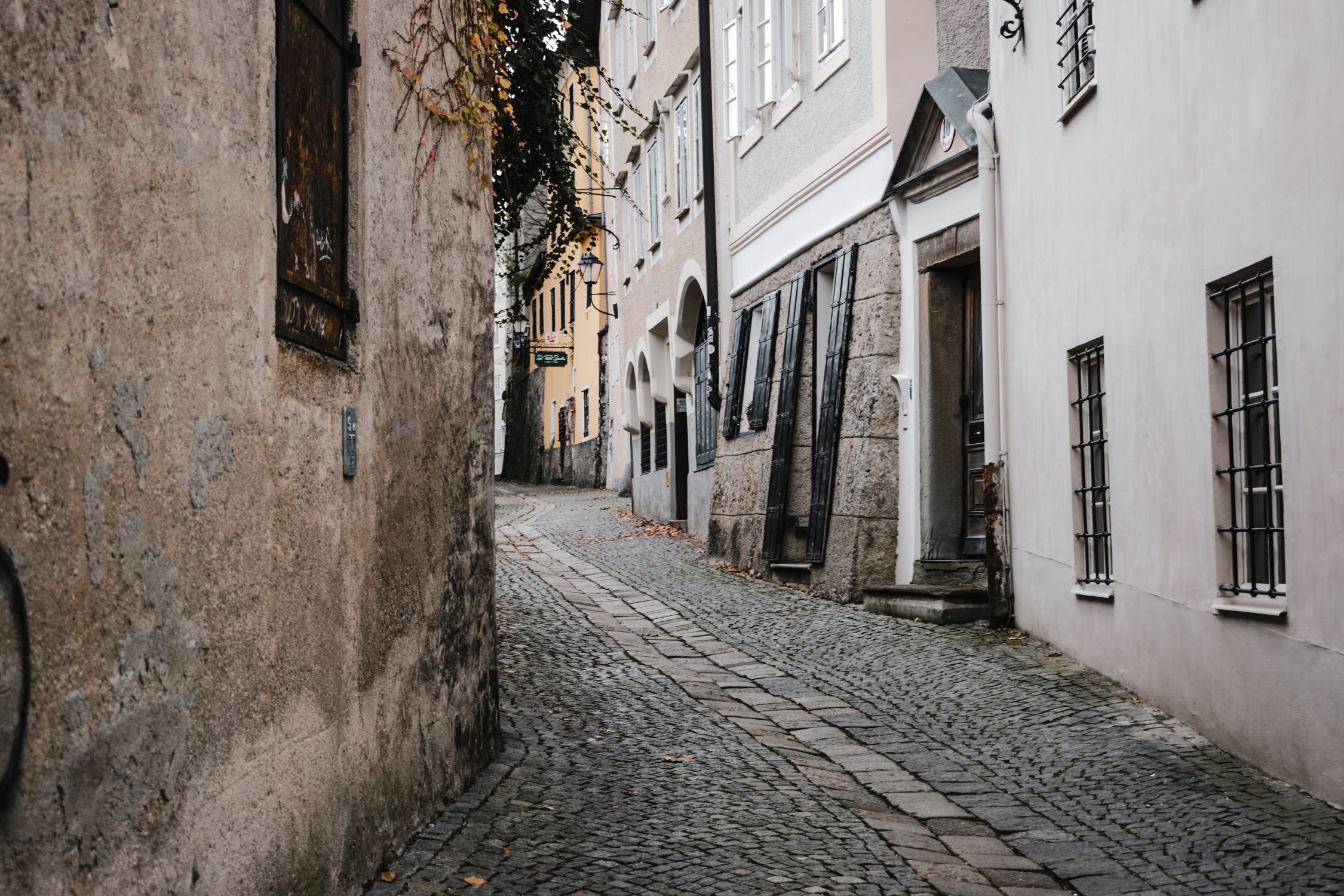 Enchanting cobblestone street in Salzburg's old town, capturing European charm and architectural beauty.