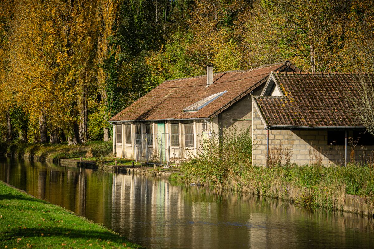 A quiet canal in the French countryside in autumn