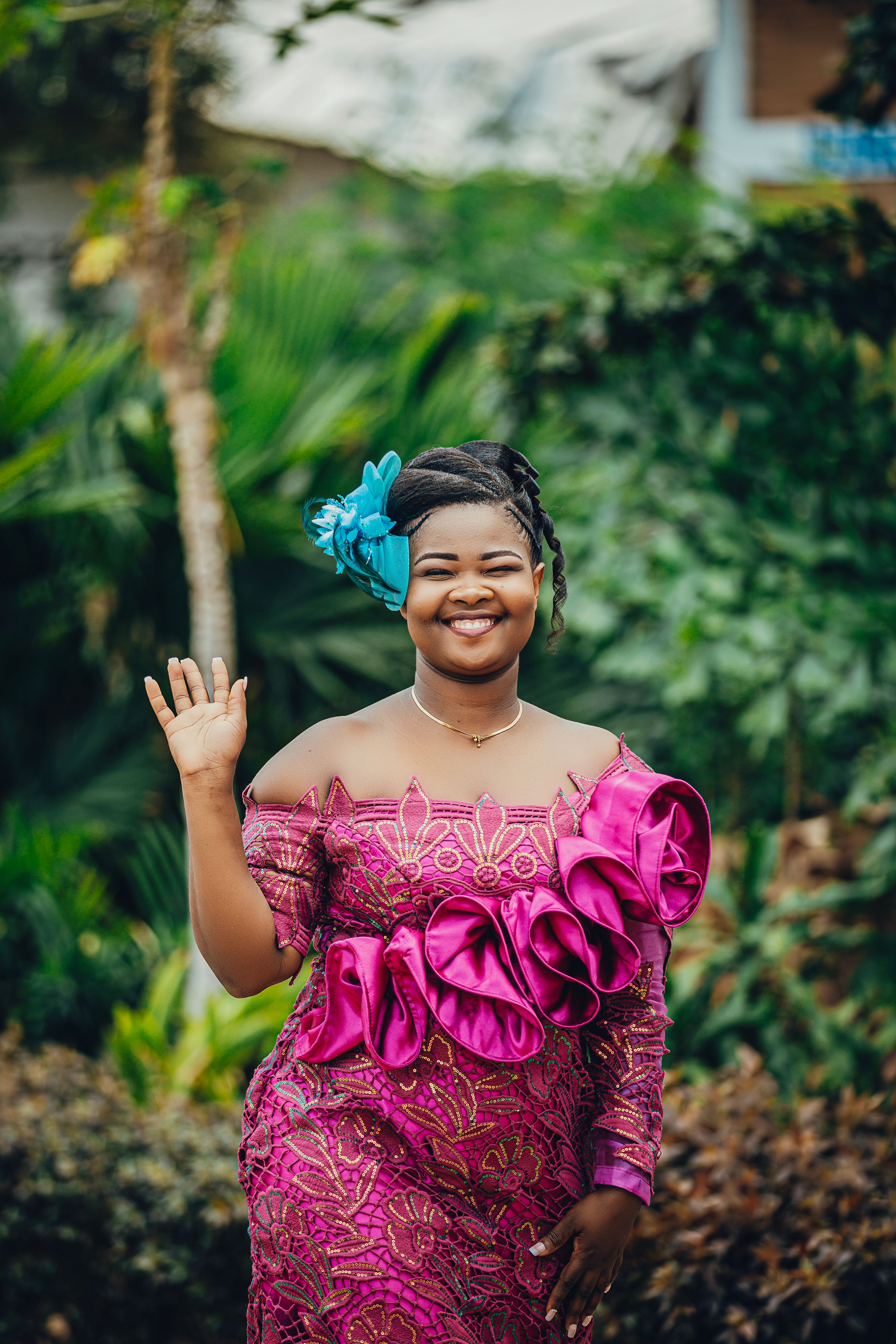 Joyful Woman in Vibrant Traditional Dress Outdoors · Free Stock Photo