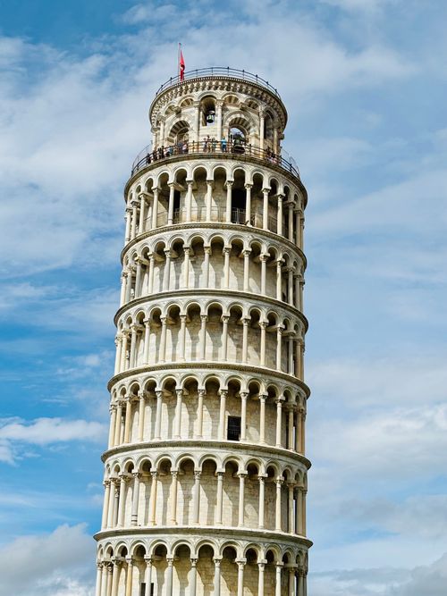 Free Explore the iconic Leaning Tower of Pisa under clear blue skies in Tuscany, Italy. Stock Photo