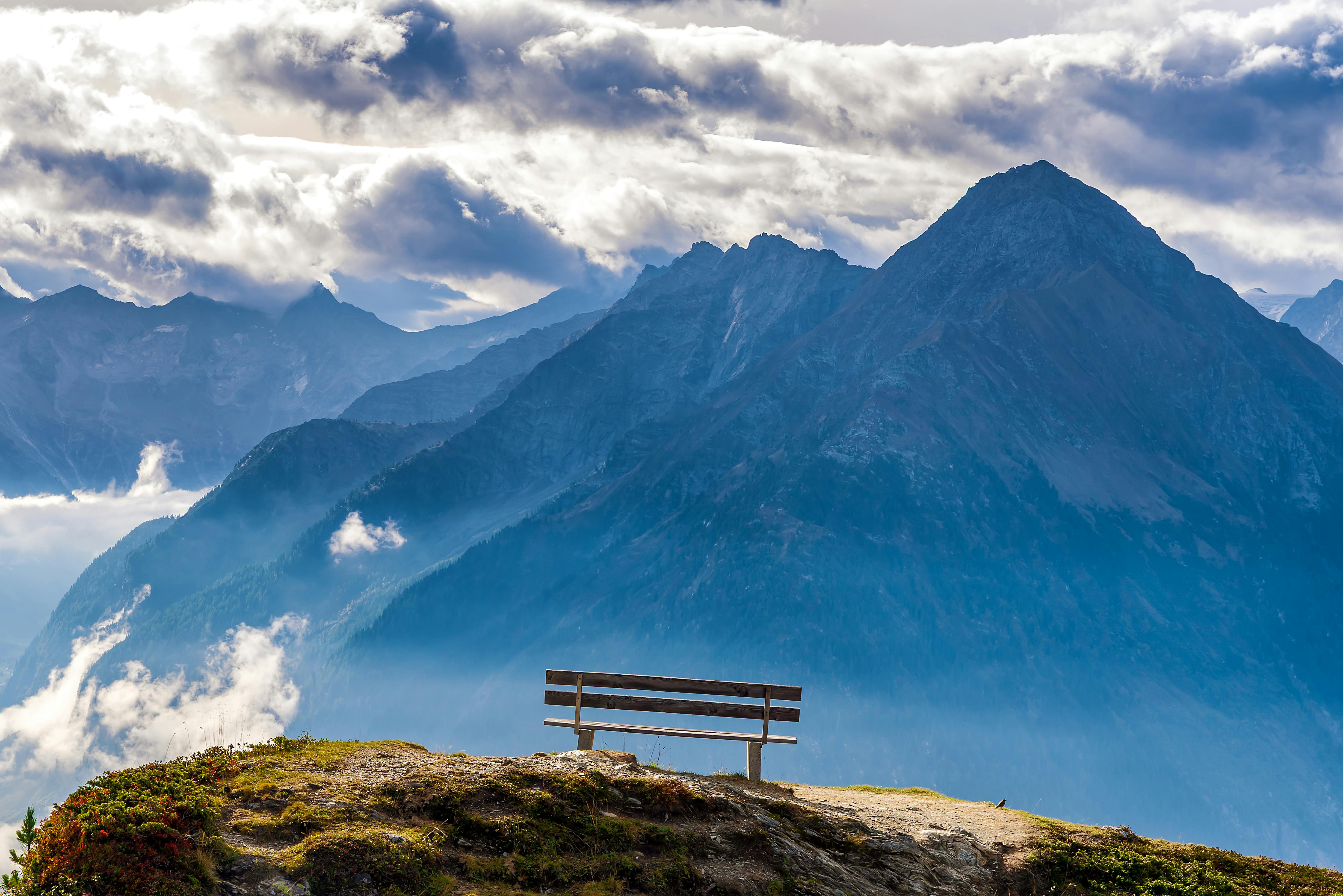 Breathtaking view of the Alps from a scenic bench in Finkenberg, Austria.