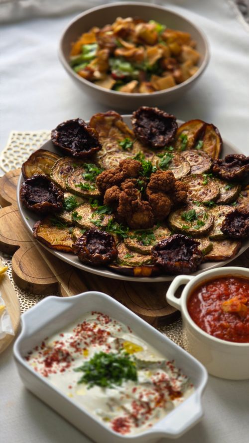 Free A vibrant Middle Eastern mezze platter with fresh dips and grilled vegetables for a cultural dining experience. Stock Photo