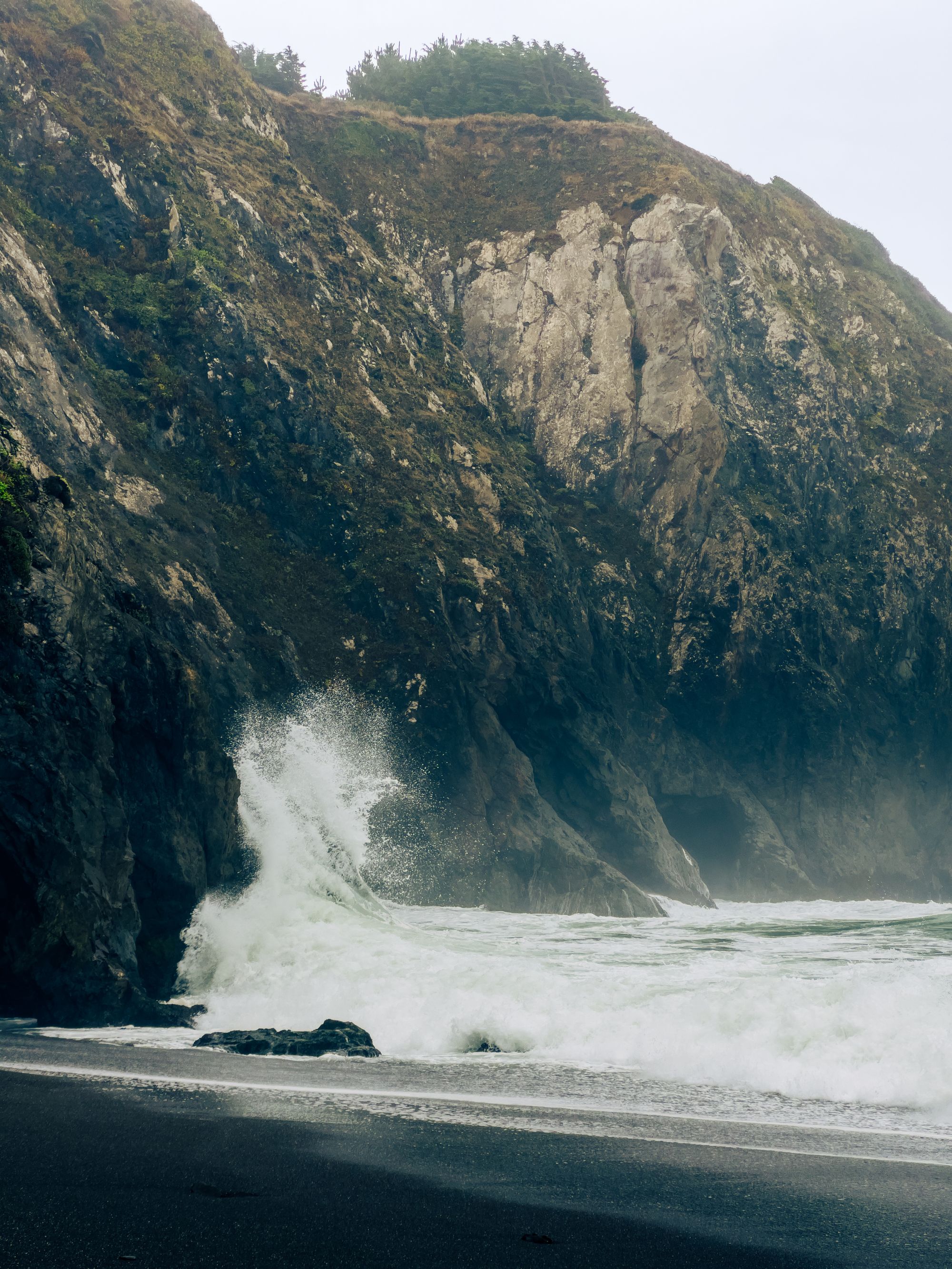 Dramatic waves crashing against rugged California cliffs on the Lost Coast, Humboldt County