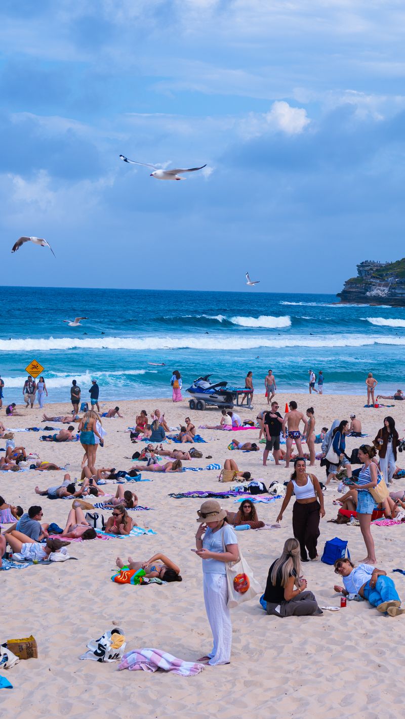 Bondi Beach sand and surf with beachgoers