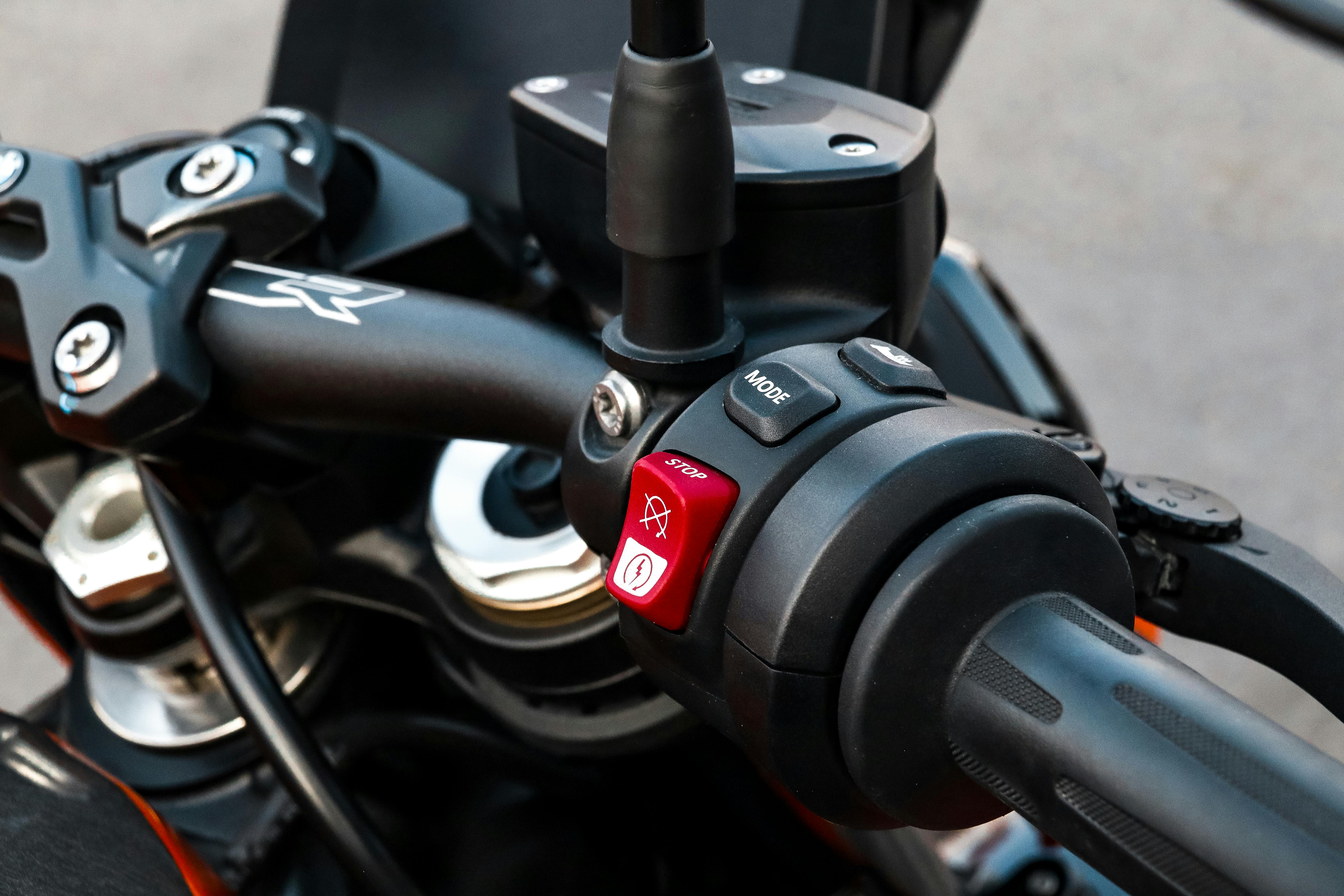 Free Detailed close-up of motorcycle handlebar controls and throttle grip. Stock Photo